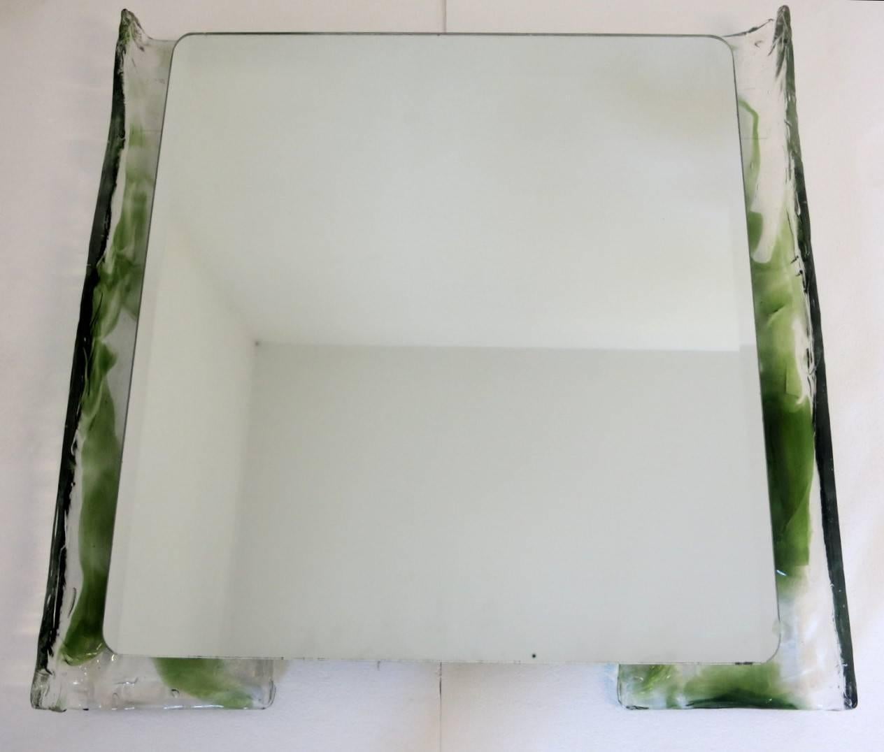 Vintage Italian bathroom set in clear and green Murano glass, includes items below:
1 back lit mirror with 4 lights: Height: 31 inches / Width 31 inches / Depth: 3 inches
1 hand towel holder: Width: 14.5, inches / Height: 4.5 inches / Depth: 3