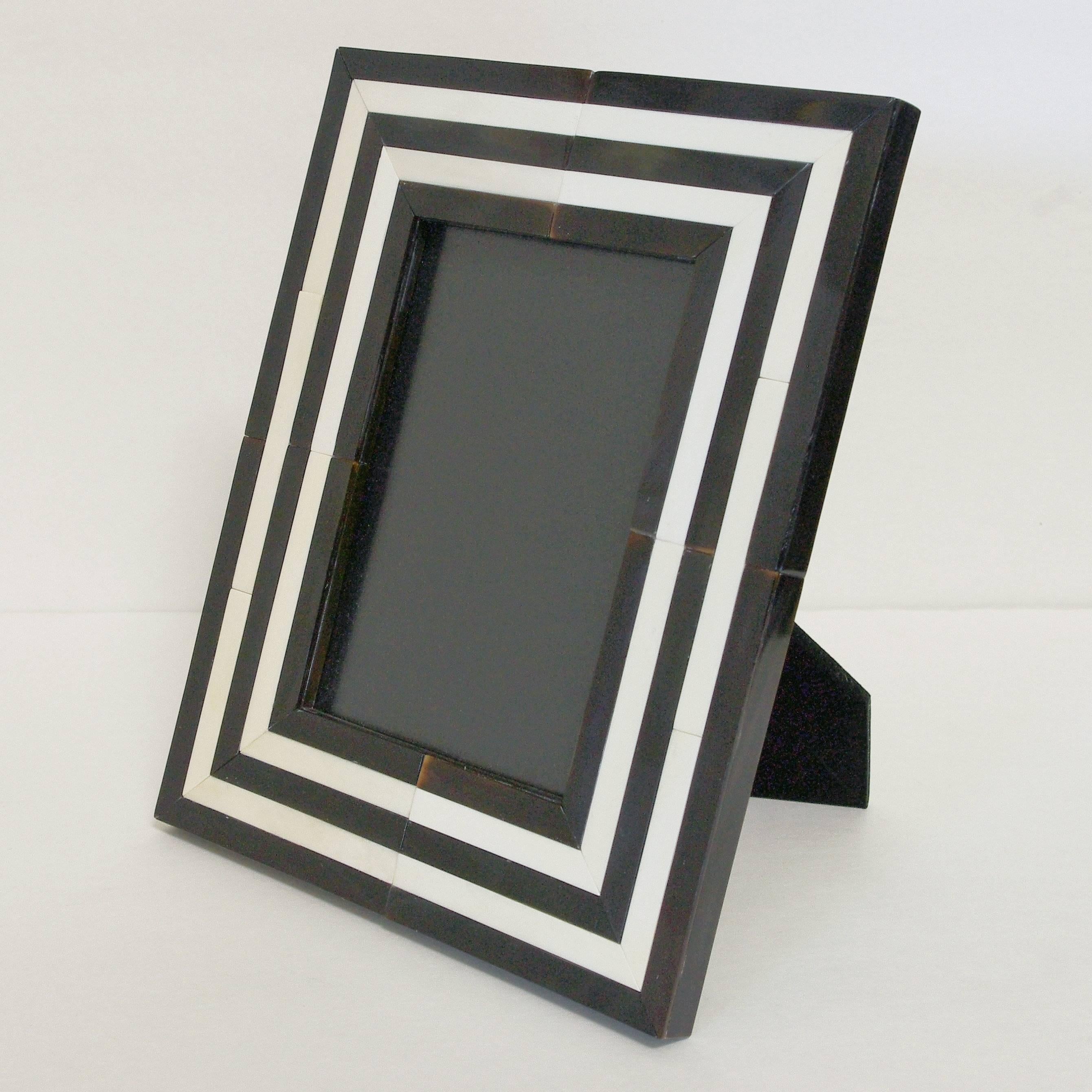 White and black horn photo frame by Fabio Ltd
Height 9.5 inches / Width 8.5 inches / Depth 6.5 inches
Photo size: 5 inches by 7 inches
1 in stock in Palm Springs currently ON 30% OFF SALE for $413 !!!
Order Reference #: FABIOLTD MR57
This piece