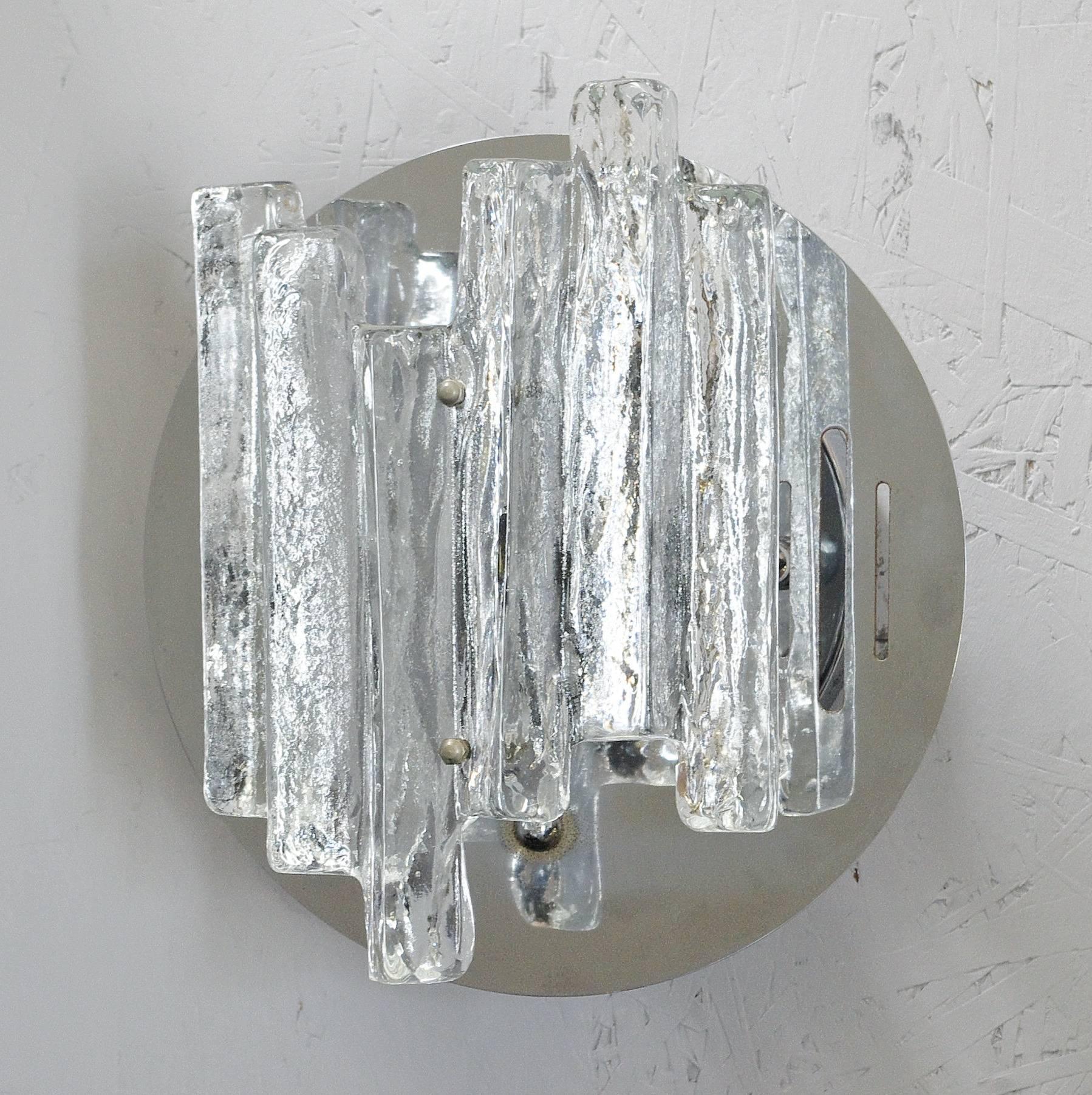 Three Italian wall lights or flush mounts with clear geometric Murano glass mounted on chrome metal frame / Designed by Salviati, circa 1960s / Made in Italy
1 light / E12 or E14 type / max 40W
Height: 11 inches /  Width: 13 inches / Depth: 8 inches