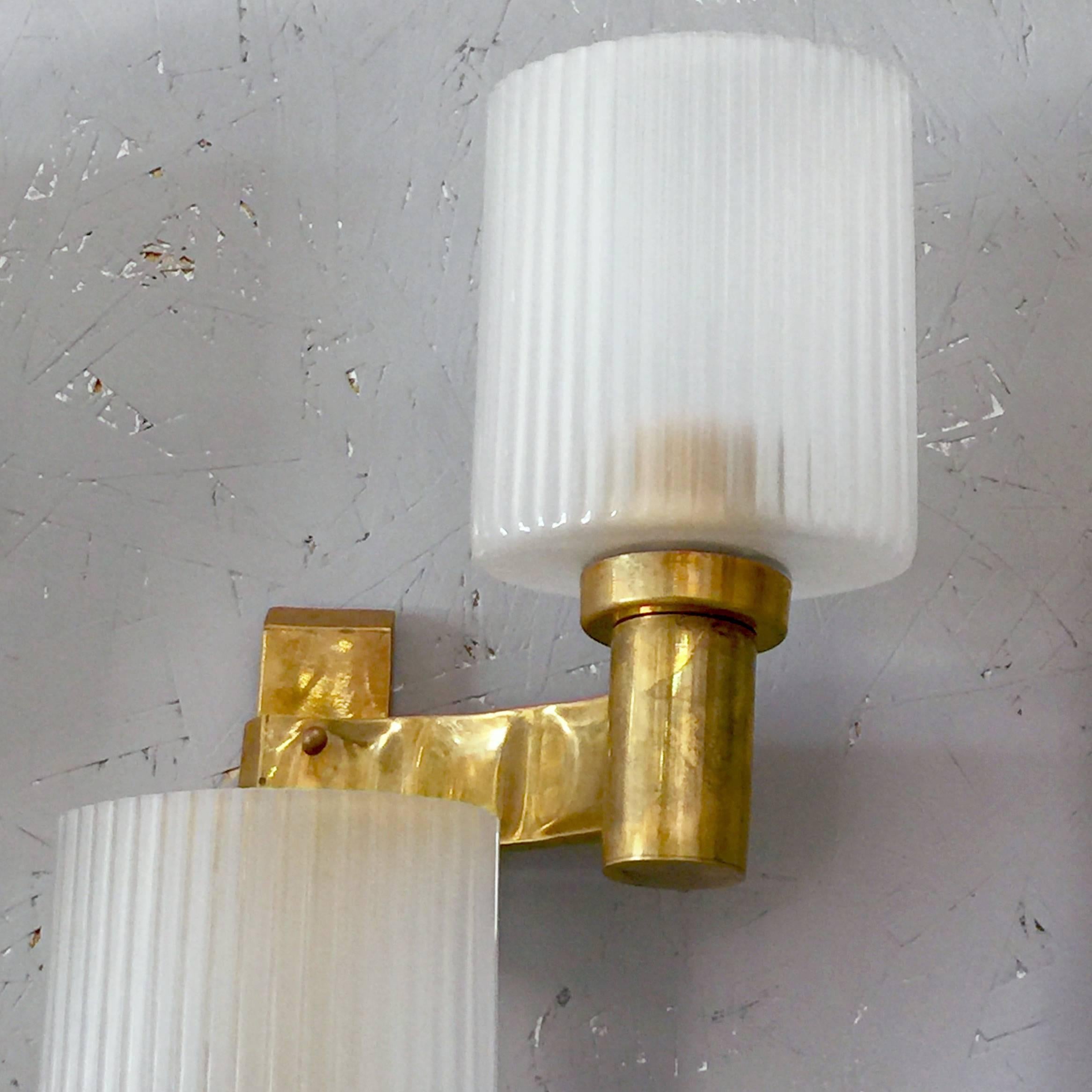 Vintage Italian wall lights with three frosted Murano glasses with textured ribbed vertical details mounted on brass frames / Designed by Stilnovo, circa 1960s / Made in Italy
3 lights / E26 or E27 type / max 60W each
Height: 27 inches / Width: 13