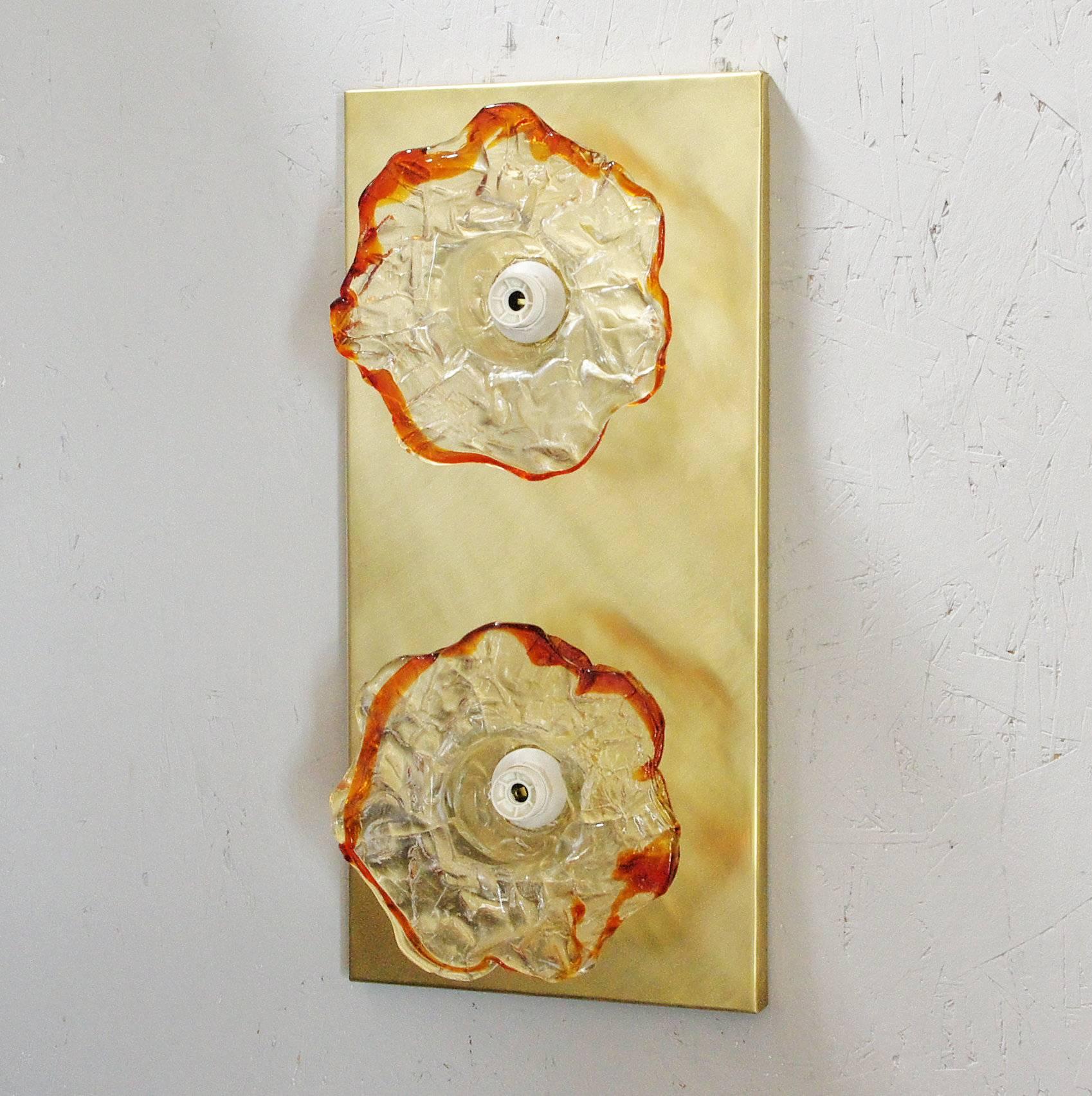 Vintage Italian wall lights or flush mounts with clear Murano glasses hand blown into textured flowers and amber Murano glass borders mounted on brass frames / Designed by Mazzega, circa 1960s / Made in Italy 
2 lights / E12 or E14 type / max 40W
