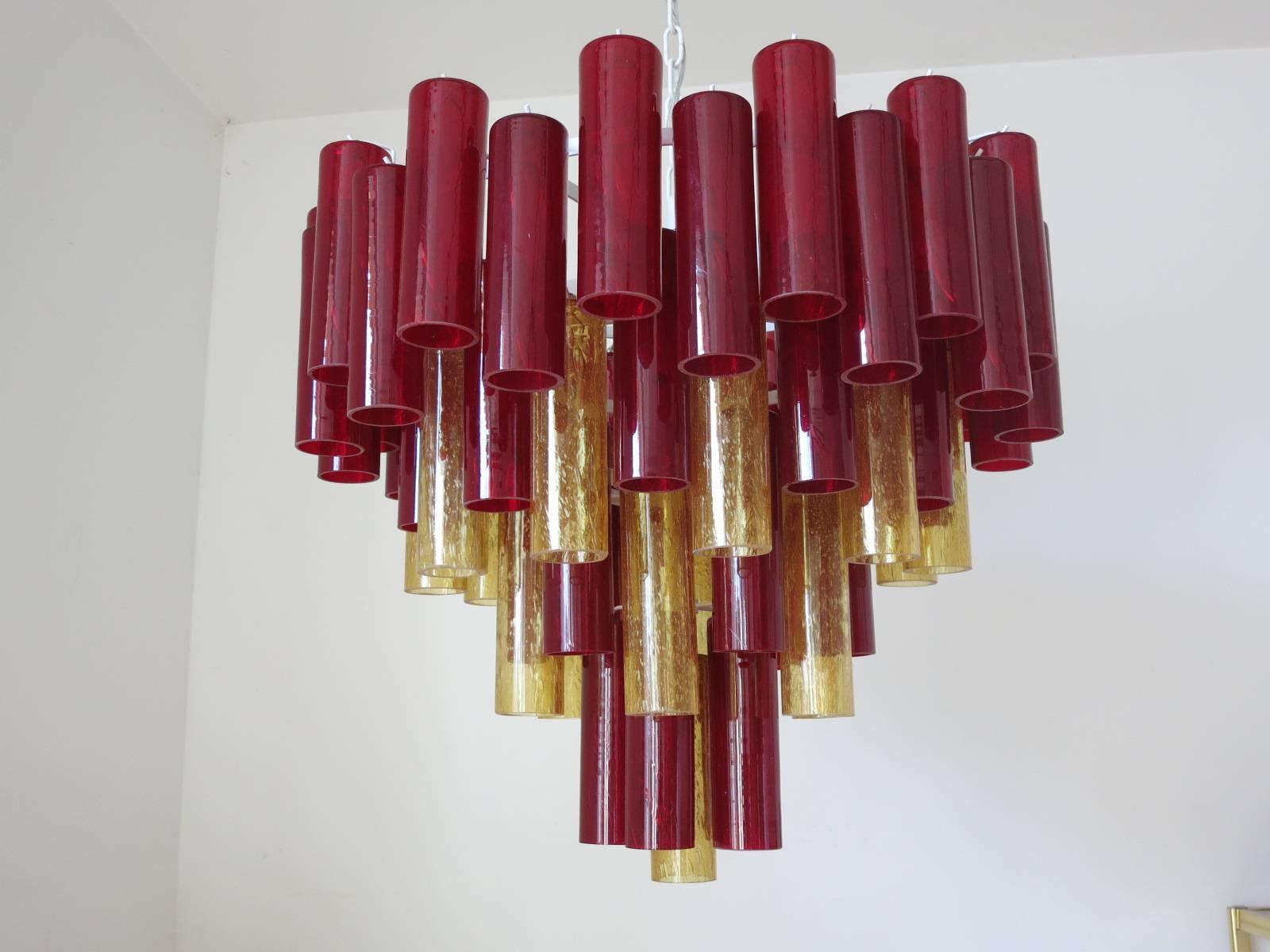 This very unusual chandelier is made of 70 unique Murano glass pieces, each individually handblown in the 1960s by Mazzega's glass maestros. 
White lacquered metal frame. 
Newly rewired with eight standard sockets.