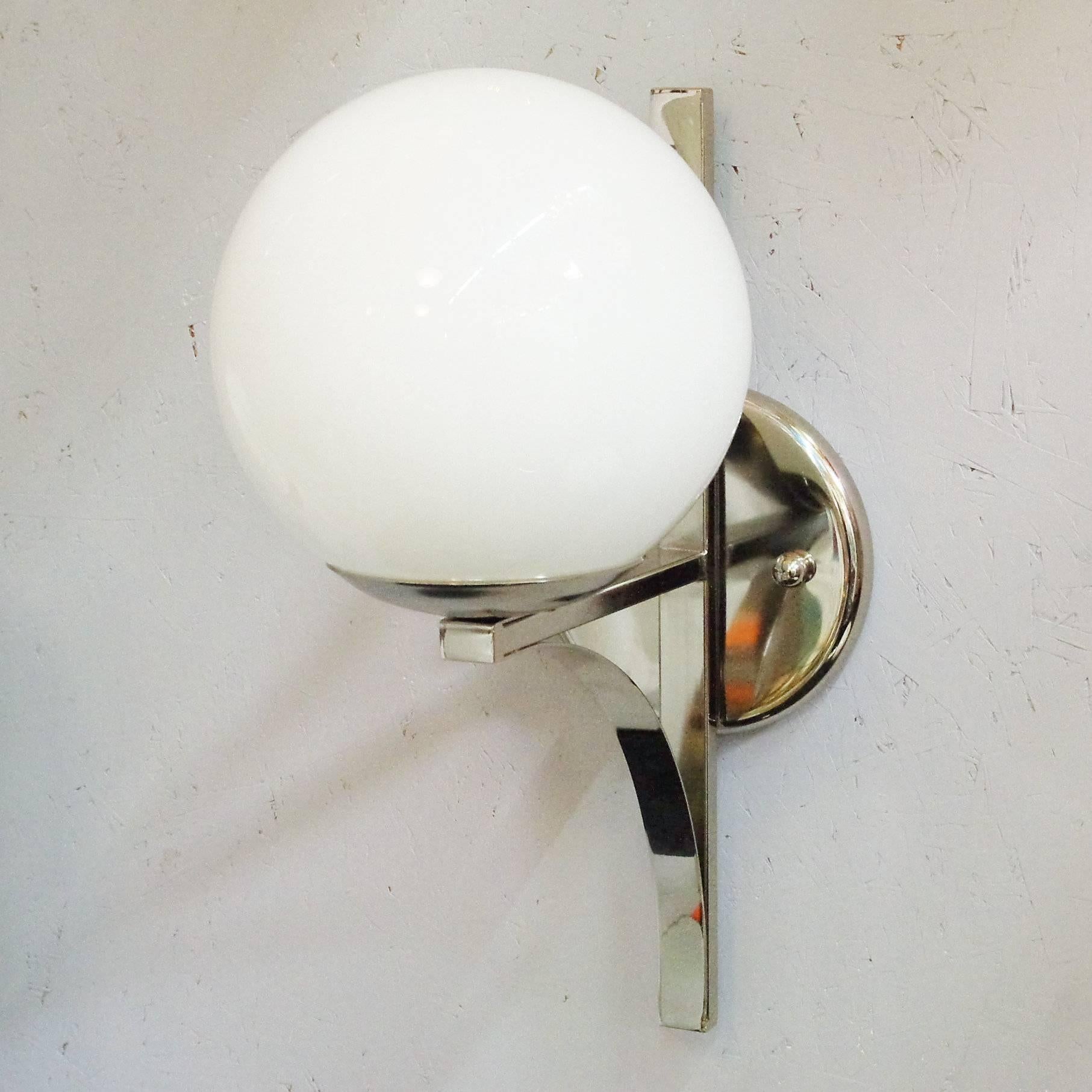 Murano glass white globes on nickel brackets sconces.
Newly rewired with single standard light socket in each sconce.
7 available / price listed is for one sconce.
