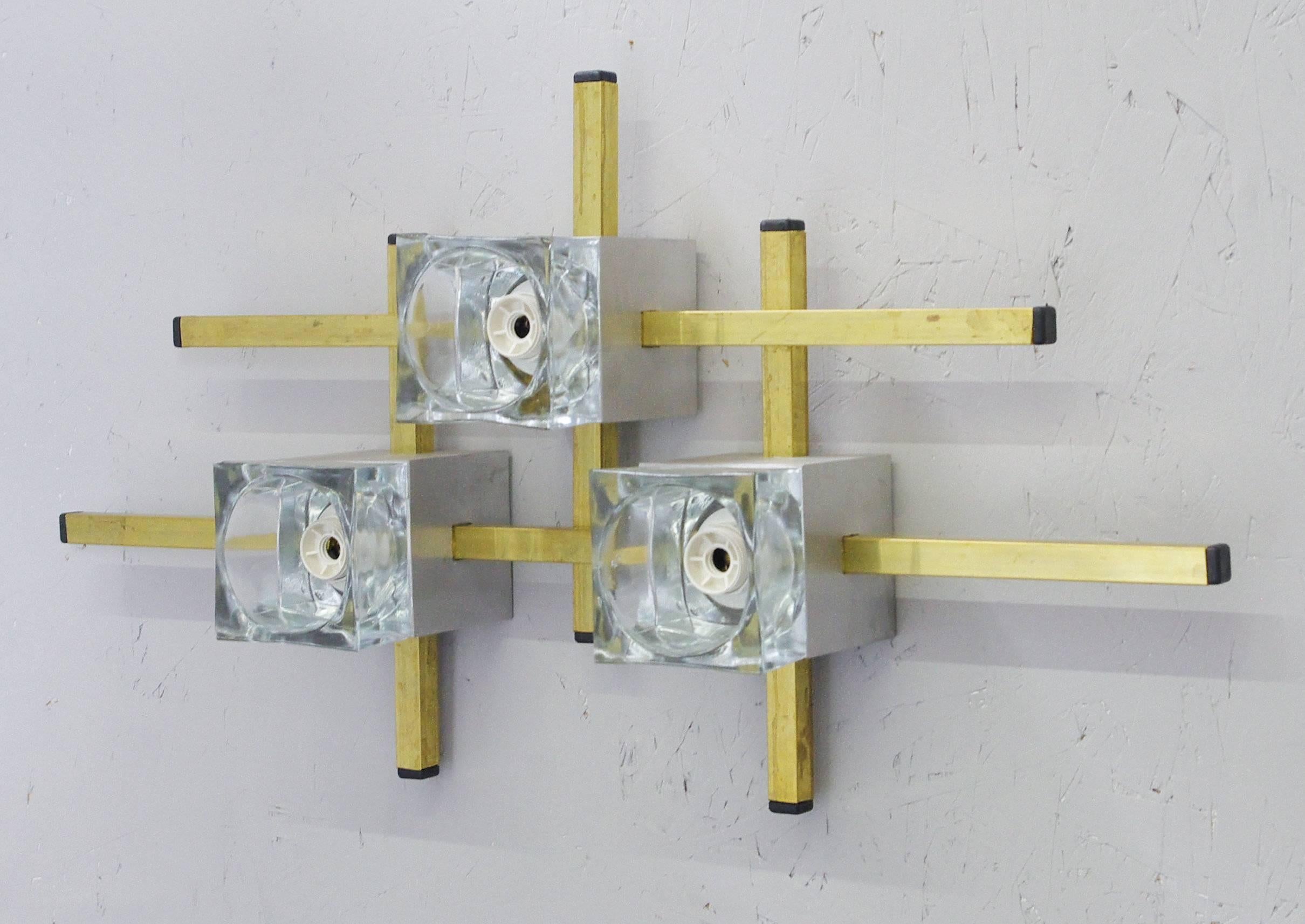 Pair of geometric sconces by Gaetano Sciolari with three glass cube lights.
Brass and aluminum hardware
3 candelabra type light sockets / wired for the US
2 pairs available