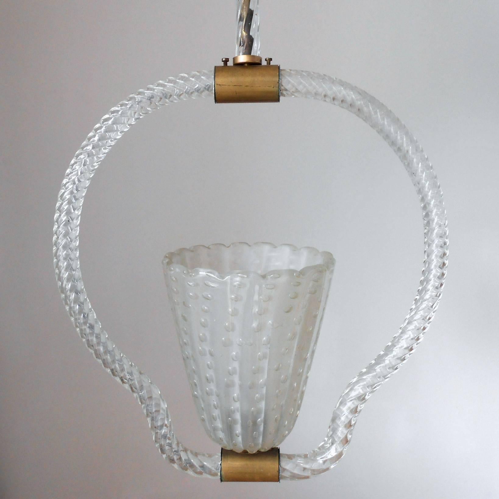 Vintage Italian pendant with clear Murano glass hand blown with bubbles within the glass using Pulegoso technique and brass details / Designed by Ercole Barovier circa 1950’s / Made in Italy
1 light / E26 or E27 type / max 60W
Height: 34 inches /