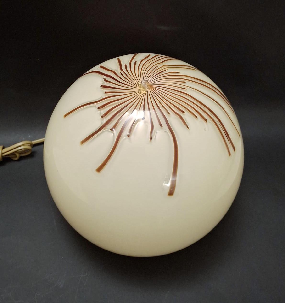 Vintage Italian table lamp with hand blown cream Murano glass globe and brown Murano glass stripes / Designed by Ludovico Diaz de Santillana for Venini / Made in Italy circa 1960s
Measures: diameter 10 inches, height 9.5 inches
1 light / E26 or E27