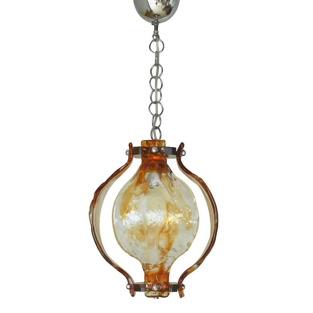 Vintage Italian pendant with hand blown infused amber and clear Murano glass petals, mounted on chrome hardware / Designed by Mazzega circa 1960’s / Made in Italy
1 light / E26 or E27 type / max 60W 
Diameter: 13 inches / Height: 16 inches plus