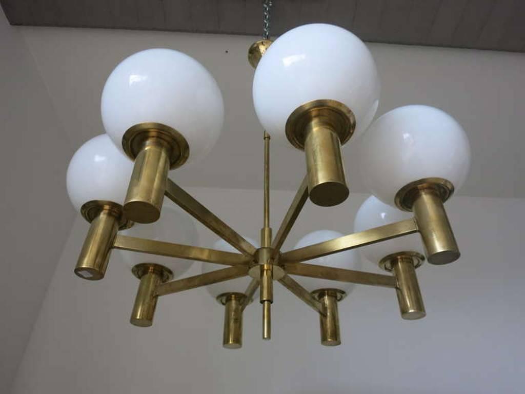 Italian vintage chandelier with eight glossy white Murano glass globes, mounted on brass frame / Designed  by Sergio Mazza circa 1960’s / Made in Italy
8 lights / E26 or E27 type / max 60W each
Diameter: 34 inches / Height: 36 inches including rod