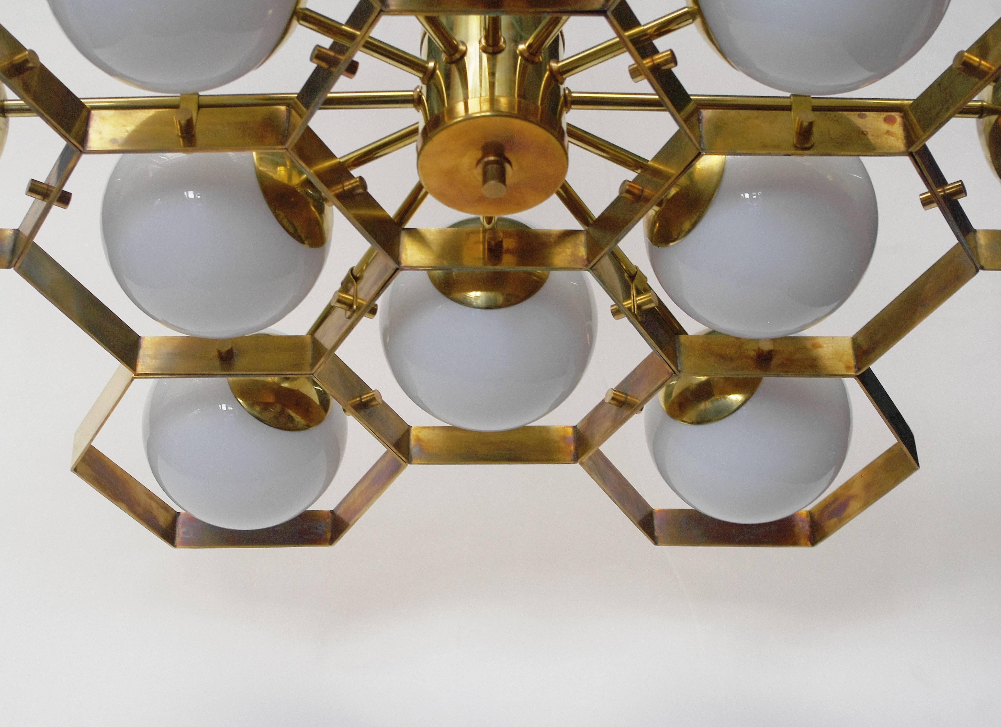 Italian modern Murano chandelier shown in glossy white Murano globes on unlacquered brass frame / Made in Italy 
12 lights / E12 or E14 type / max 40W each  
Diameter: 36 inches / Height: 30 inches including rod
1 in stock in Palm Springs currently