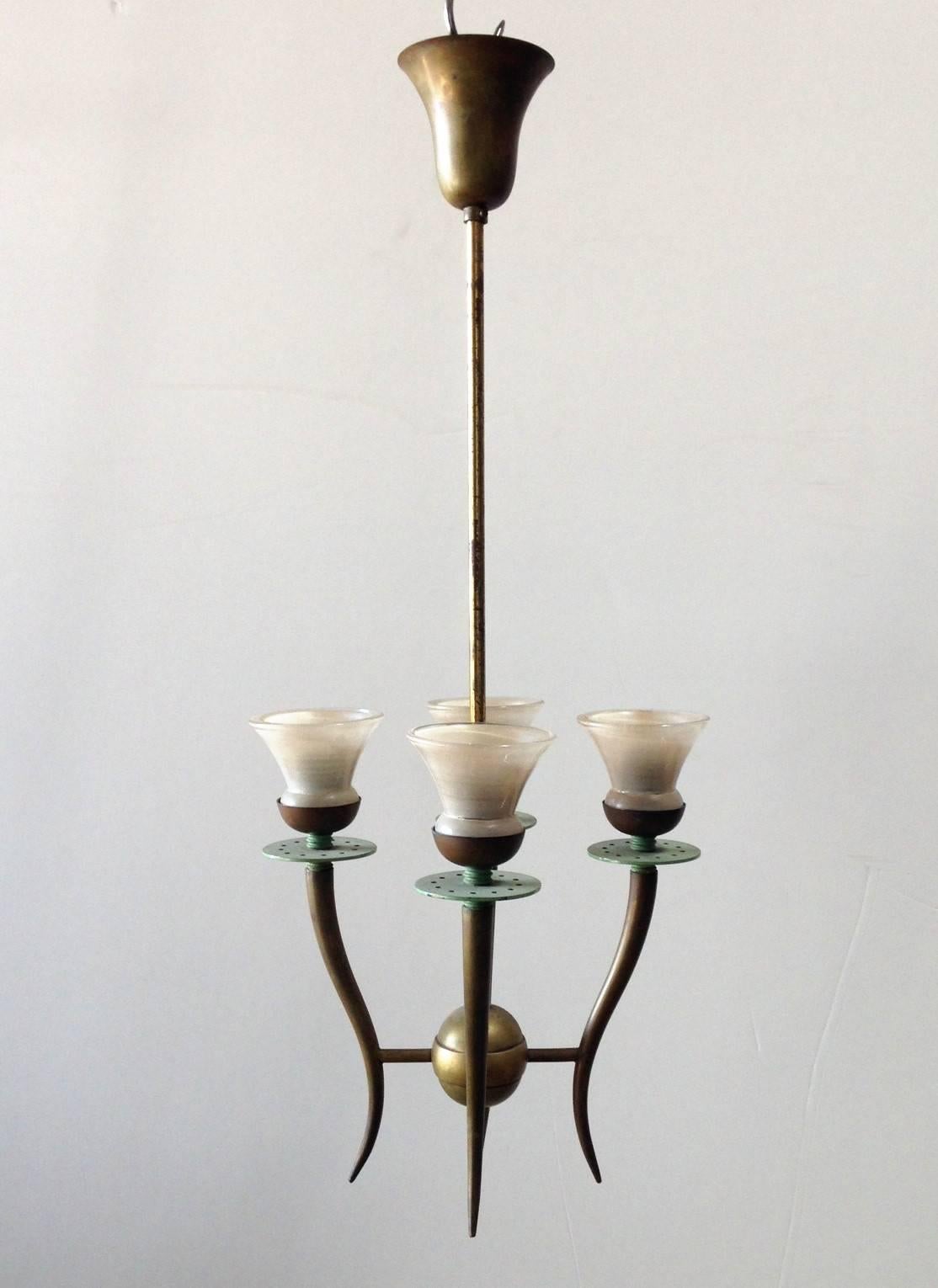 Vintage Italian pendant with four white Murano glasses hand blown in the shape of tulips, mounted on brass frame / In the style of Stilnovo / Made in Italy circa 1950’s
4 lights / E12 or E14 type / max 40W each
Height: 25 inches including rod and