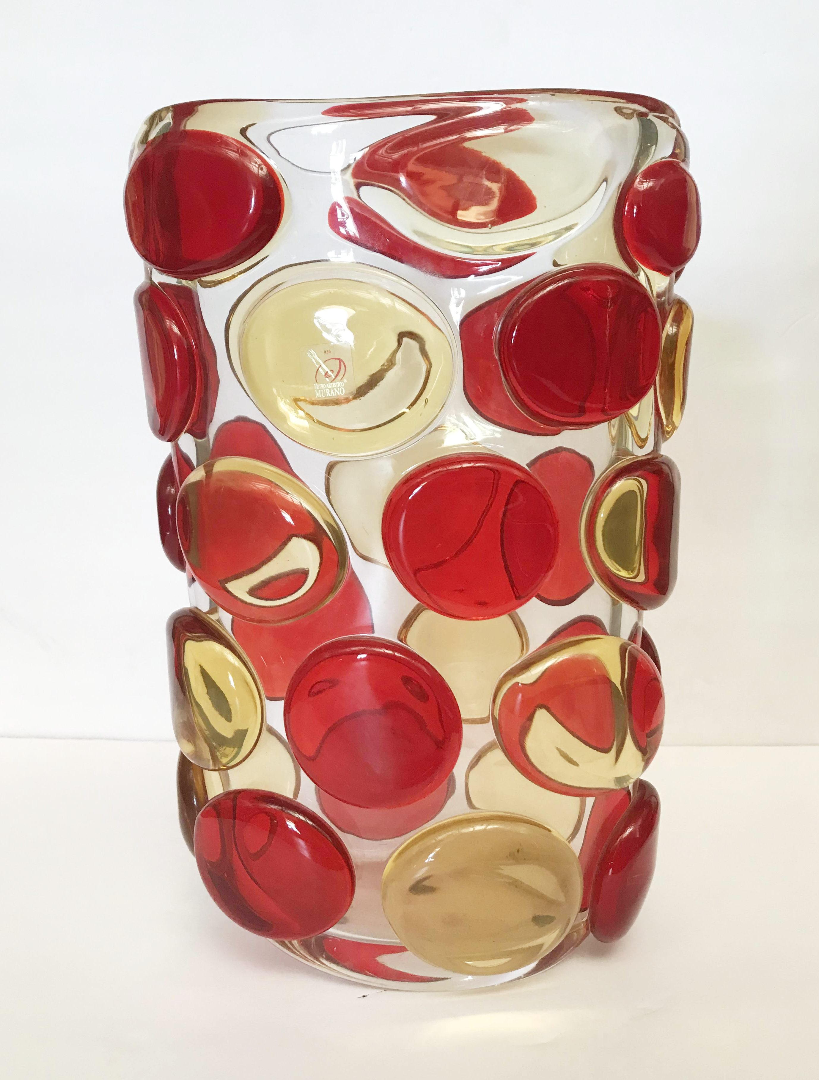 Beautiful vase with clear Murano glass body and decorative red and yellow Murano glass buttons by Camozzo and signed on the base
Made in Italy in the 1970’s
Height: 13.5 inches / Width: 9 inches / Depth: 5.5 inches
1 in stock in Palm Springs