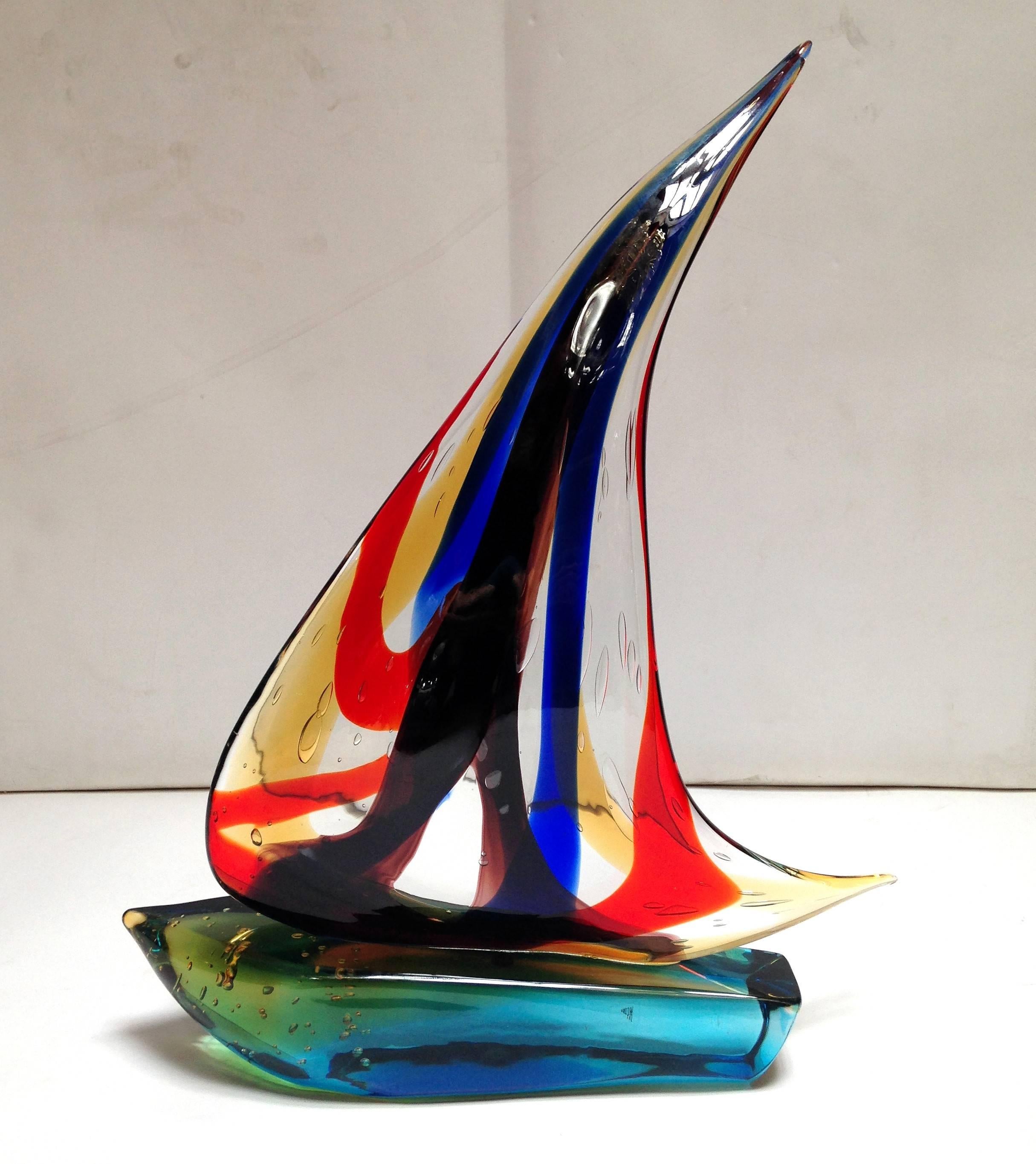 Vintage Italian single sail boat hand blown and crafted in multiple colored Murano glass by Sergio Constantini 
Signed on the base / Made in Italy in the 1960’s 
Height: 22 inches / Width: 14 inches / Depth: 4 inches 
1 in stock in Palm Springs