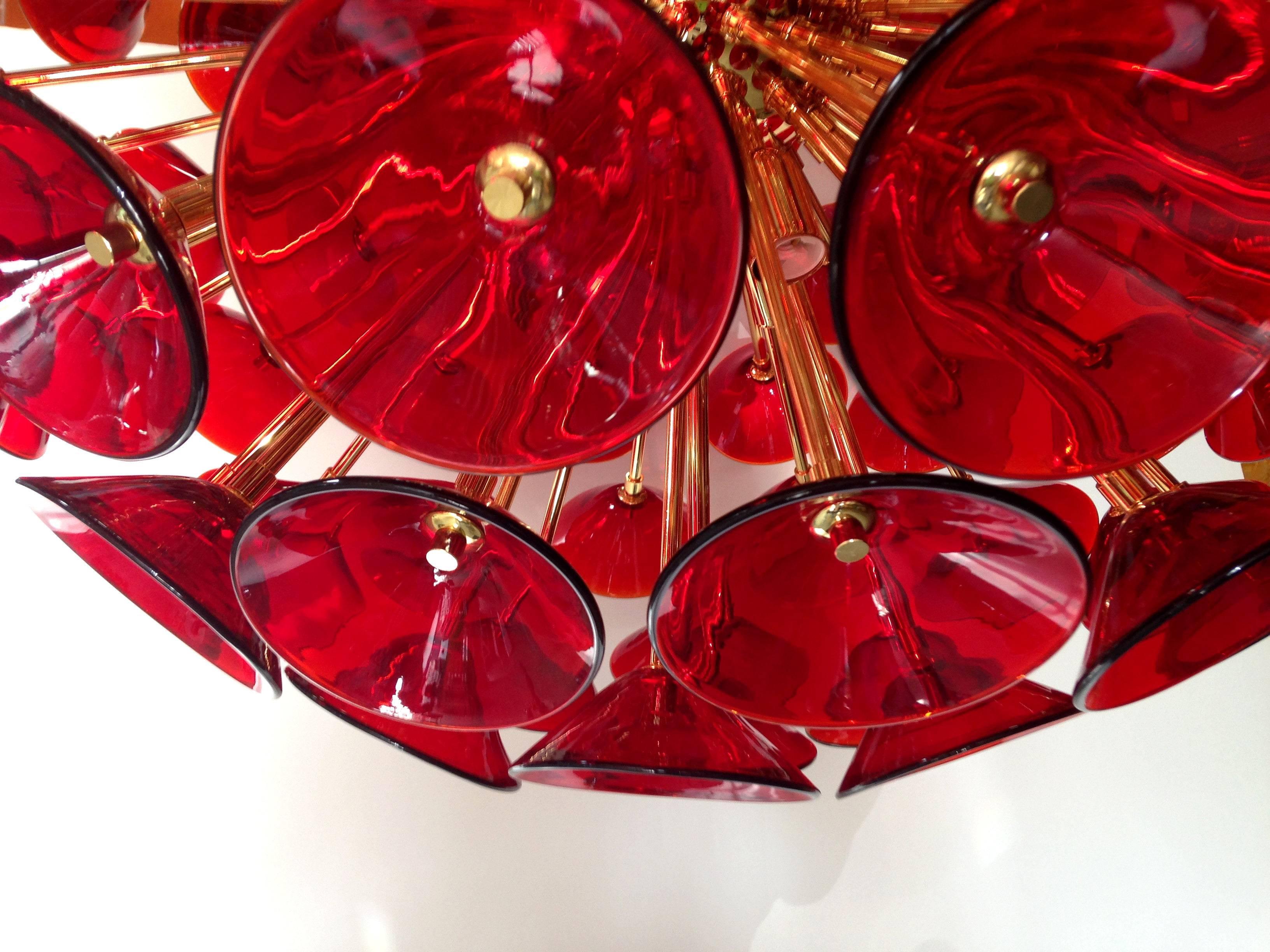 Vintage sputnik chandelier with red Murano glass trumpets by Vistosi on new 24k gold metal finish frame by Fabio LTD / Made in Italy
Diameter: 29 inches / Height: 29 inches + chain
12 lights / E12 type / max 40W each
1 in stock in Palm Springs
Order