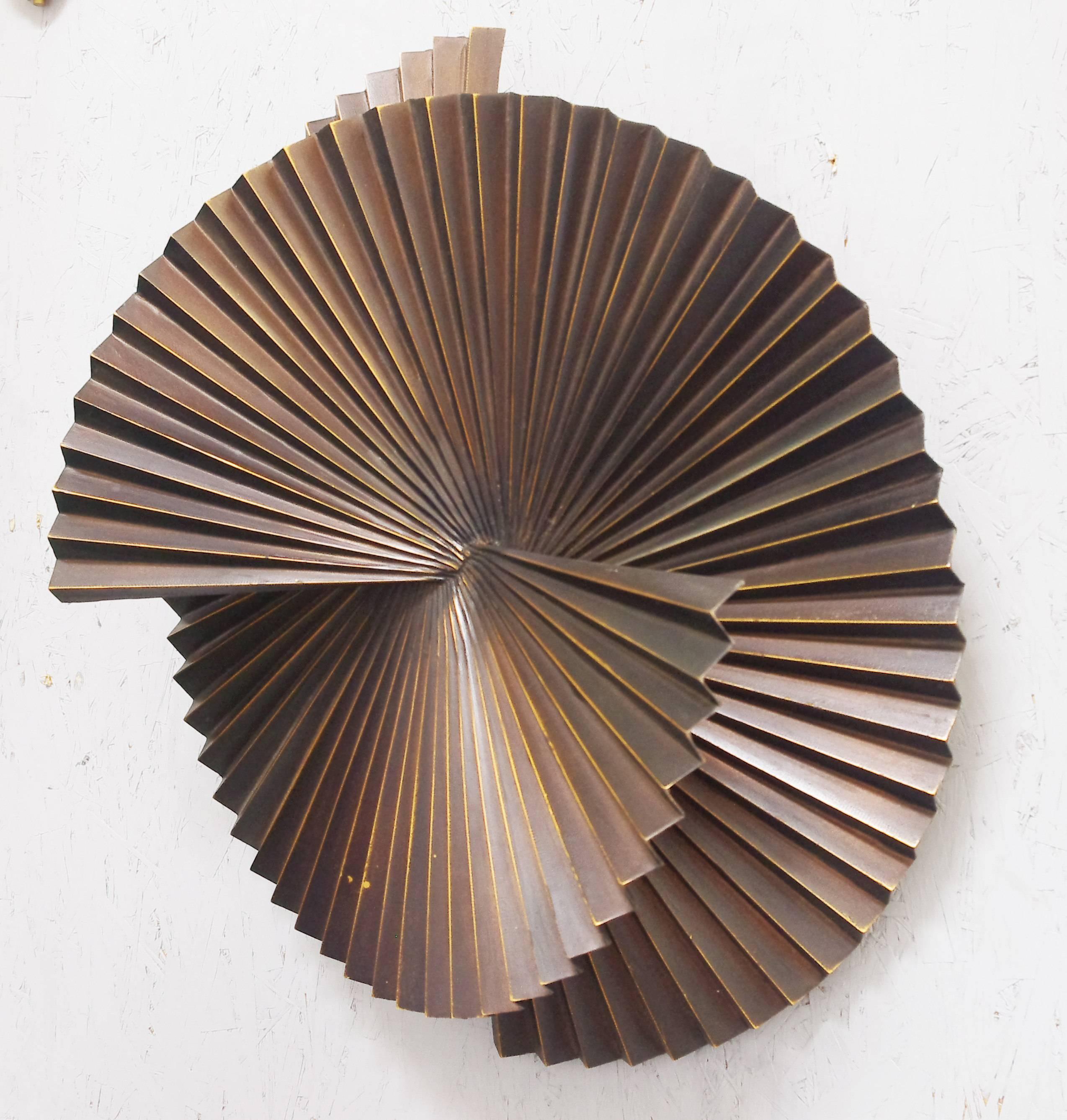 Limited edition large dark bronzed metal sconce or wall sculpture in spiral fan design / Designed by Fabio Bergomi for Fabio Ltd 
1 light / E26 or E27 type / max 60W
Diameter: 28 inches / Depth: 8 inches 
1 in stock in Palm Springs currently ON SALE