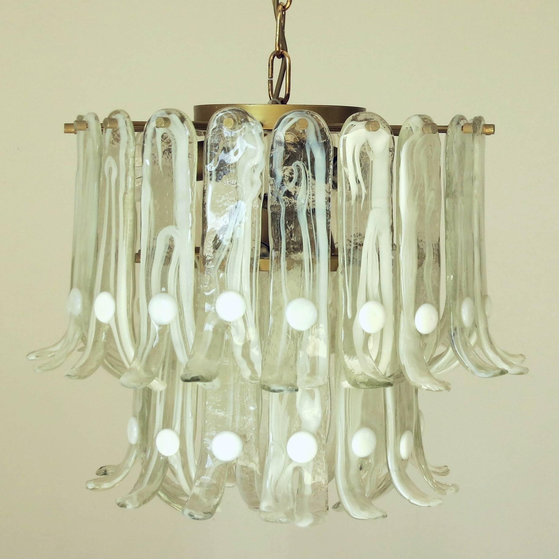 Vintage Italian chandelier with pale green Murano glass petals hand blown with diffused white details and split ends, mounted on brass frame / Designed by Mazzega circa 1960’s / Made in Italy
** Please note 1 glass has minor damage, see the last