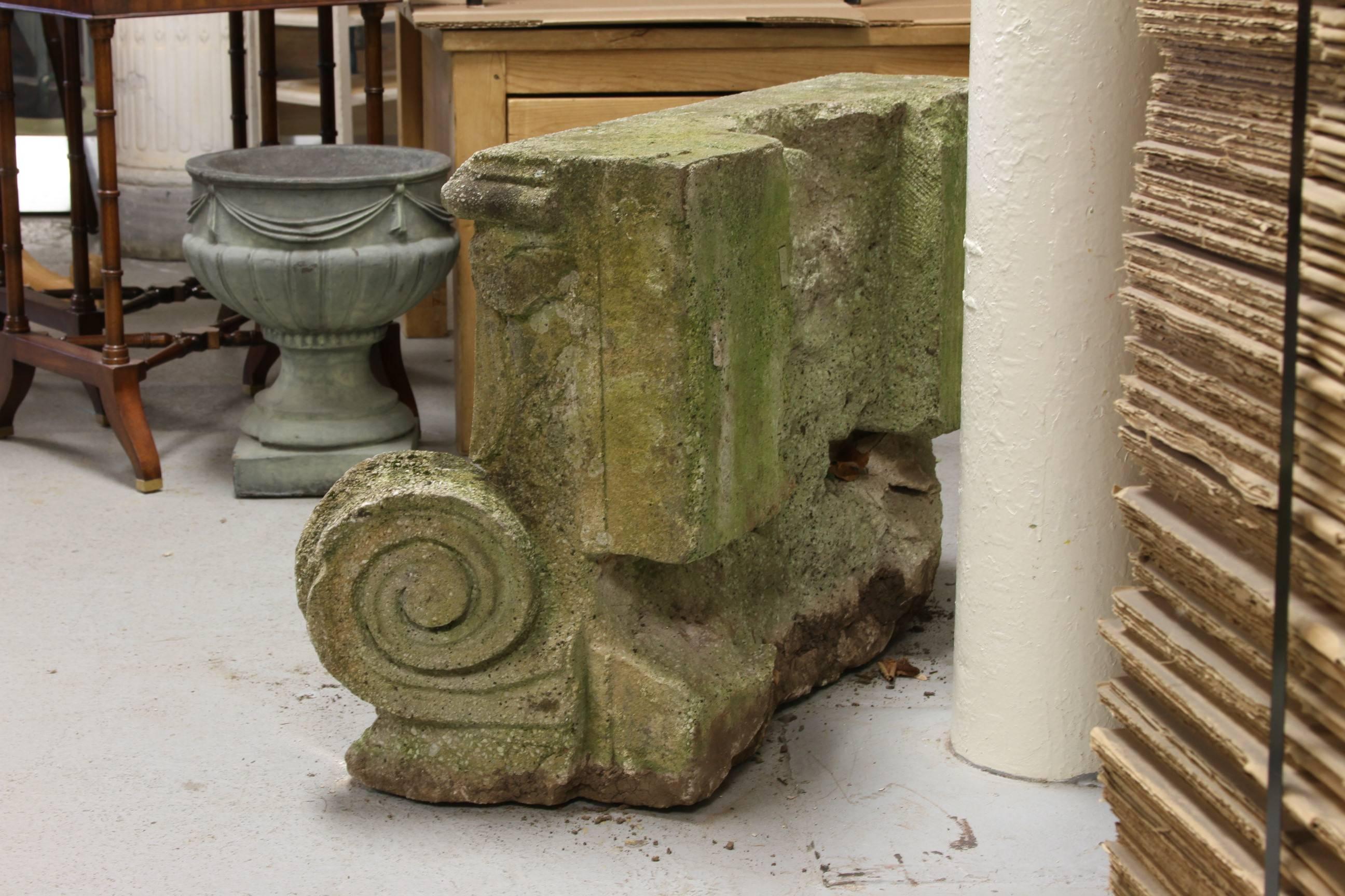 A very large cast stone garden capital with excellent age and patina. Extremely sturdy with good weight and suitable as garden ornament, bench, or table base.