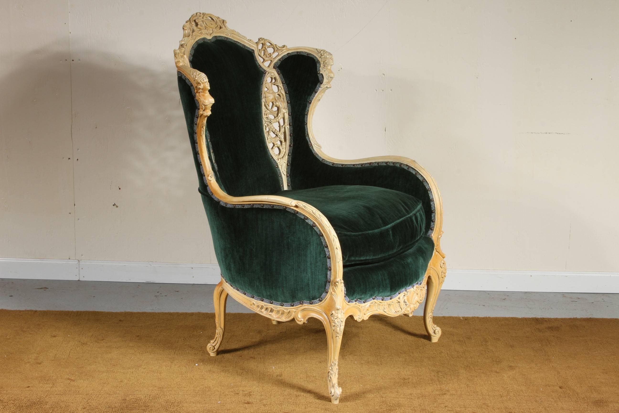 With great presence and style, having a carved and pierced creme paint frame and quality custom emerald green fabric.