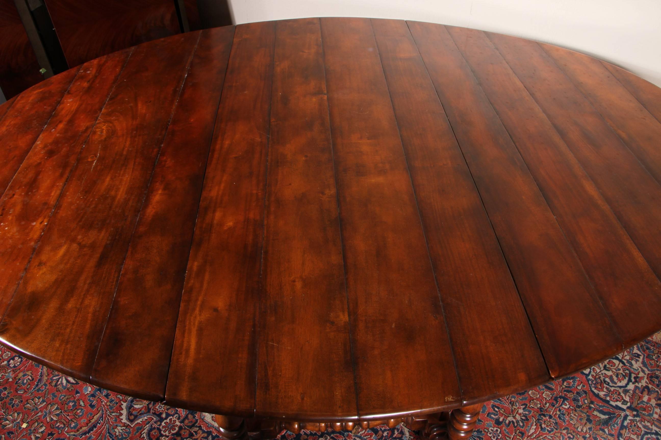 With well figured walnut, excellent craftsmanship and lots of uses, dining, library, hallway or as a console. Dimensions below are for the closed table, with the two 30