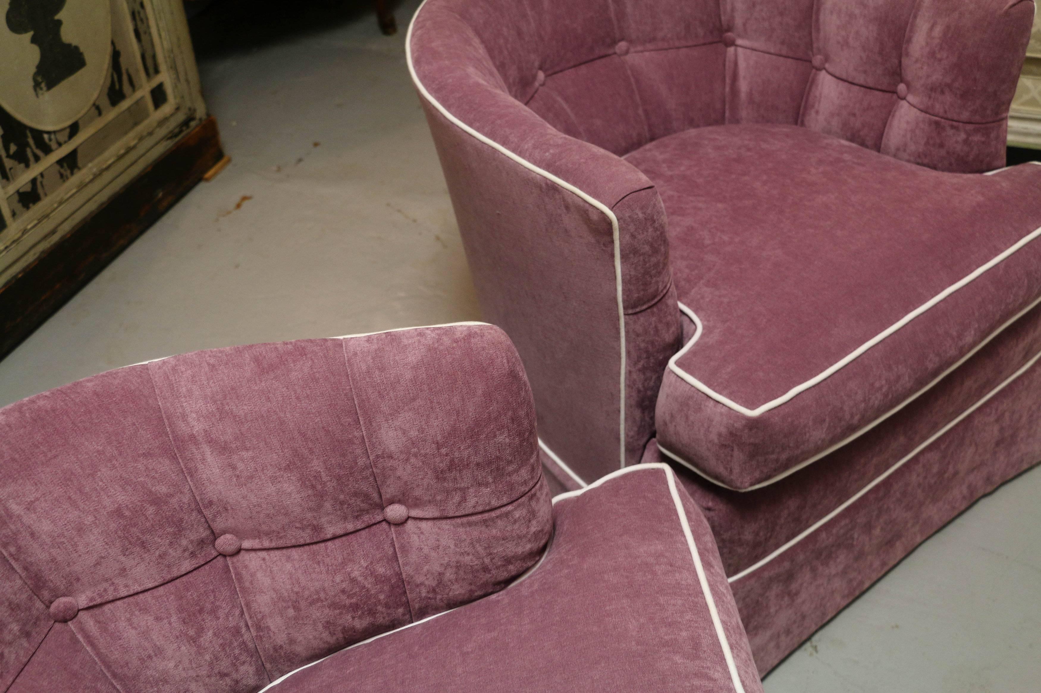 Very comfortable club chair pair with good proportions, tufted back and contrast welding. Custom upholstered in a quality light plum velvet.