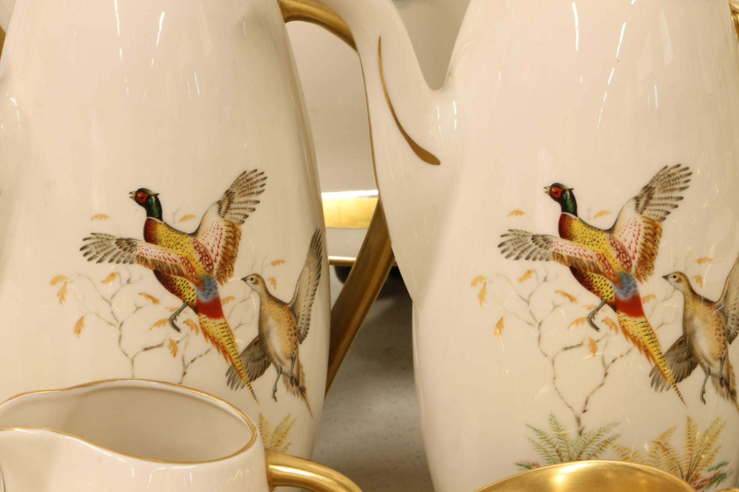 Rare and outstanding set of the "Game Birds" pattern dinnerware by Flintridge in excellent condition. Ivory background with thick gilt accent. The set includes: (16) 10.75 inch; dinner plates
(16) 8.5 inch salad/ luncheon plates
(16) 6.5