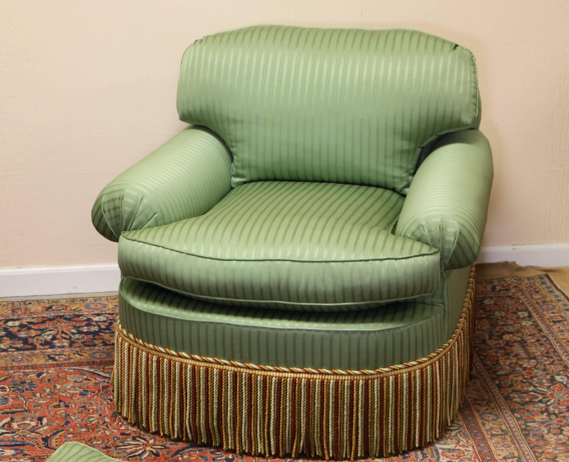 Great form, style, and comfort with quality custom upholstery and fringe. Very good condition. The dimensions for the chairs are given below. The crescent form conforming ottomans are 32