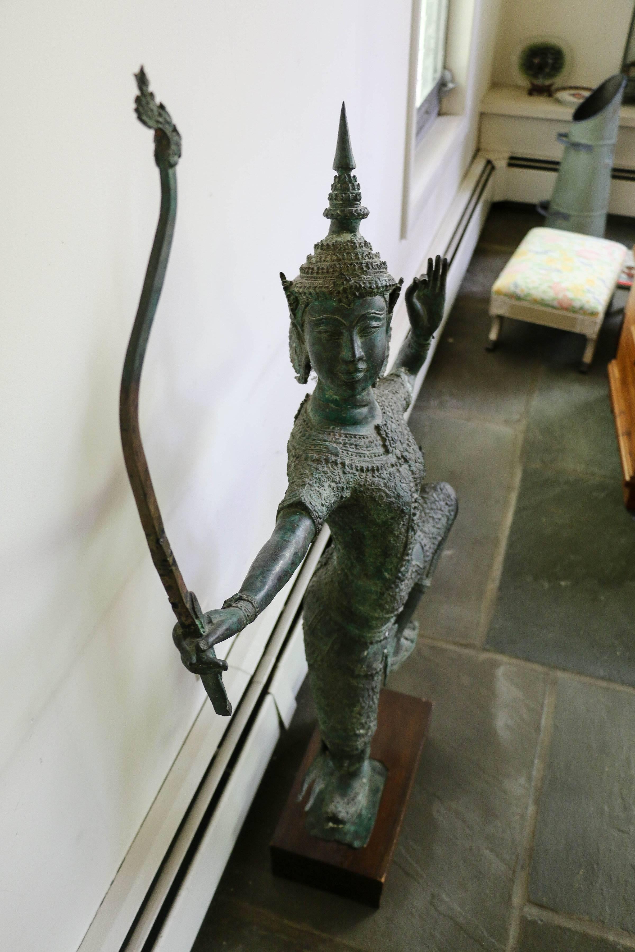 Cambodian, Balinese or Thai bronze with fine form and excellent deep green speckled with white patina. Very serene and the image of poise, a wonderful sculpture. The lower half of the bow as well as the arrow are missing.