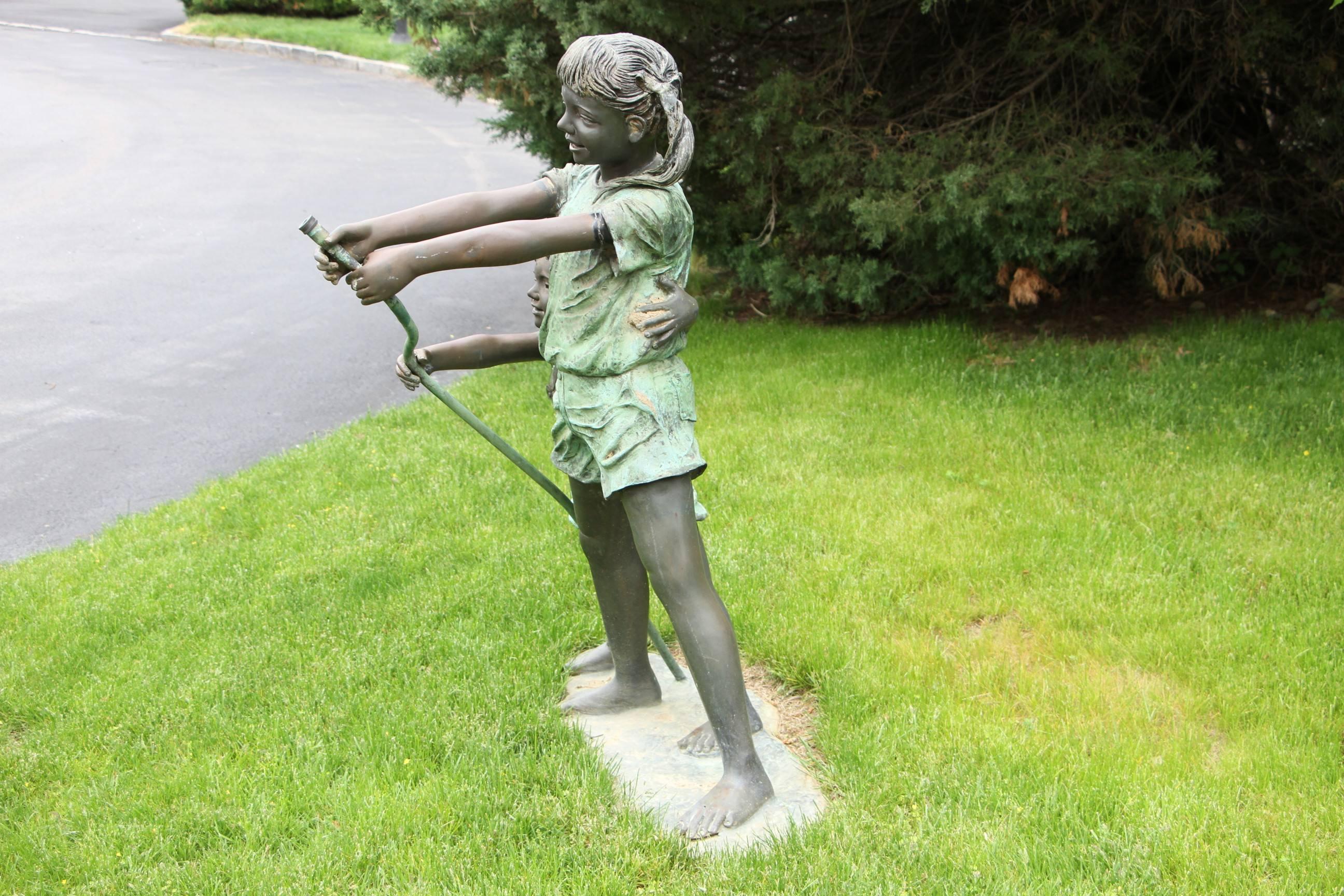 Bronze Boy and Girl with Hose Sculpture In Excellent Condition In Bridgeport, CT