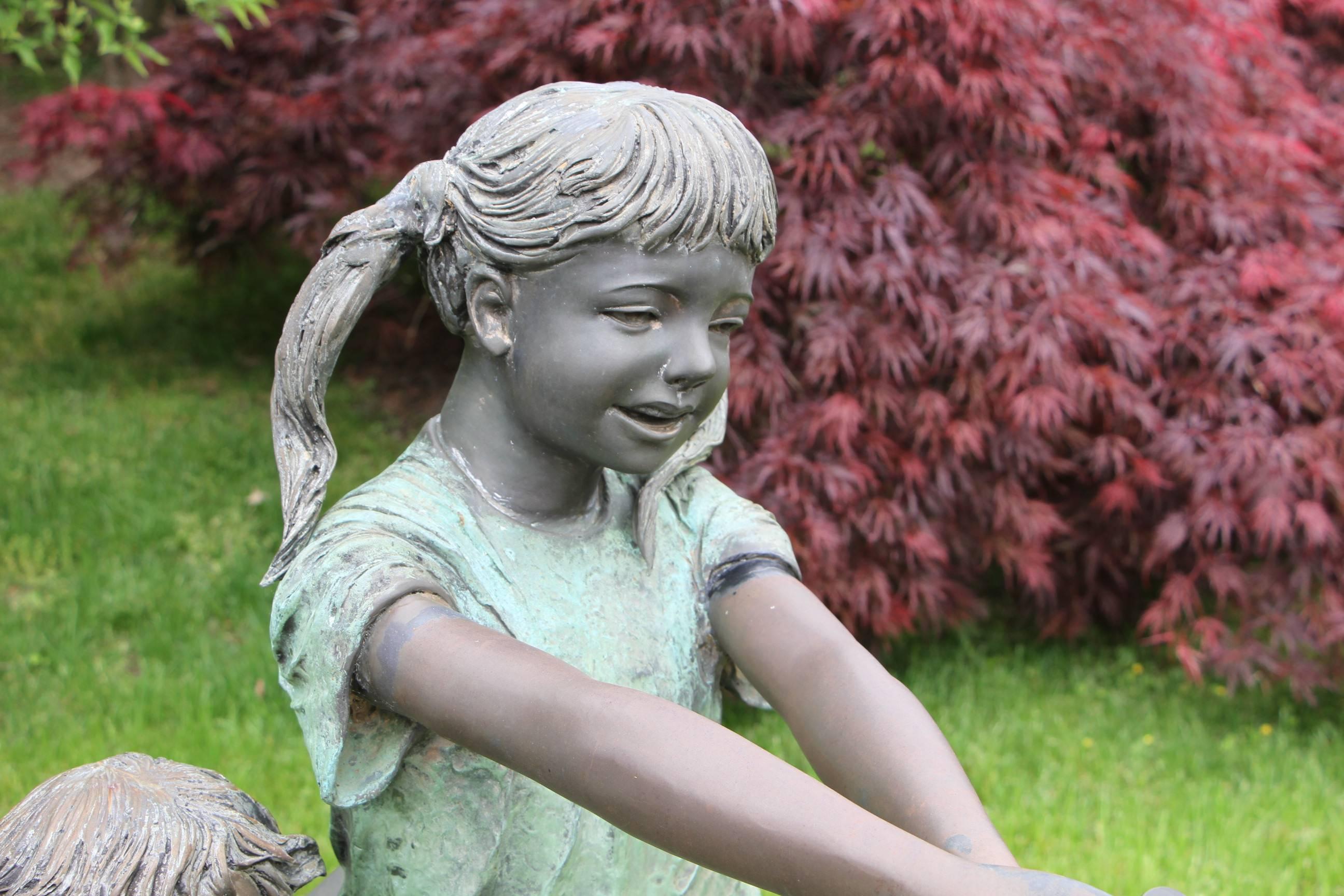 20th Century Bronze Boy and Girl with Hose Sculpture