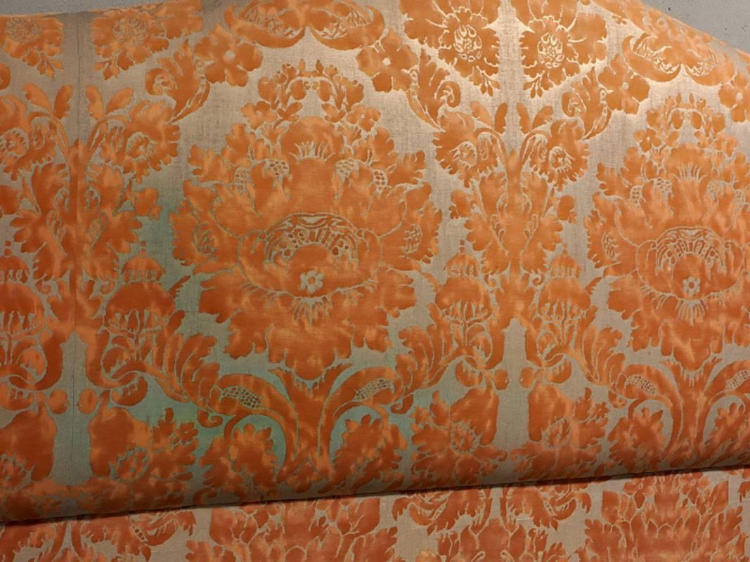 King headboard upholstered in floral metallic and apricot Fortuny fabric having a camel back shape.
Measures: 81