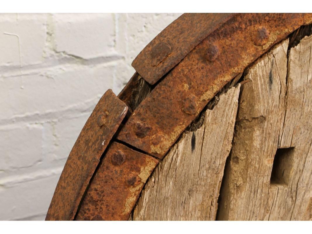 Antique Chinese Wooden Wheel with Steel Mounts In Distressed Condition In Bridgeport, CT