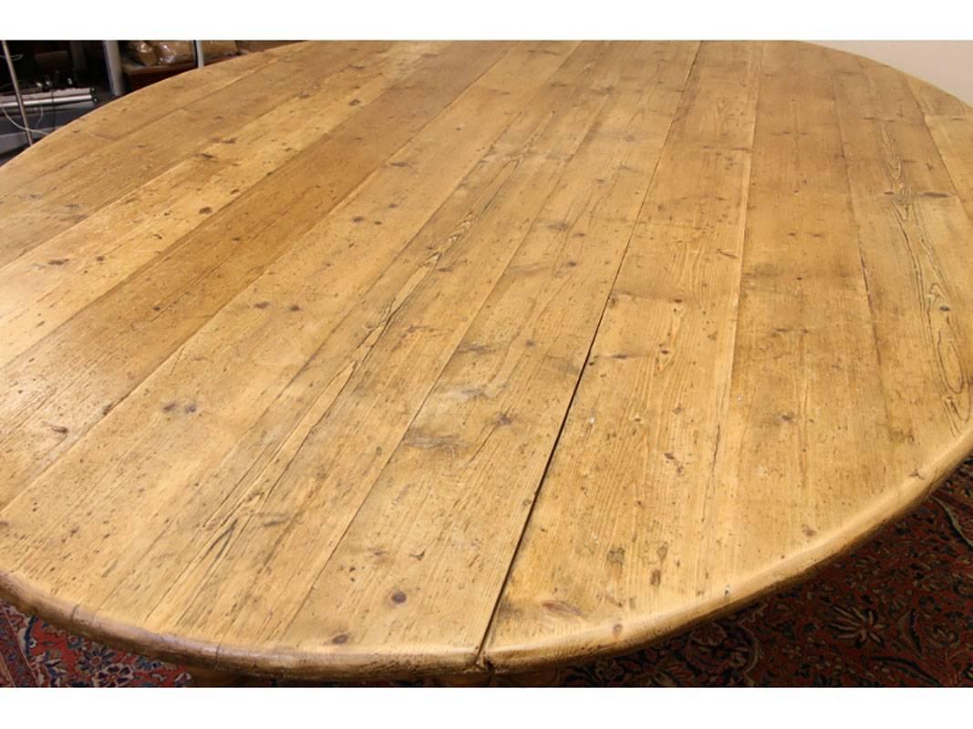 Chosen reclaimed antique pine plank top table with turned legs. Generous proportions and excellent form. Gentle age warping to boards that adds to the overall effect of this great table.