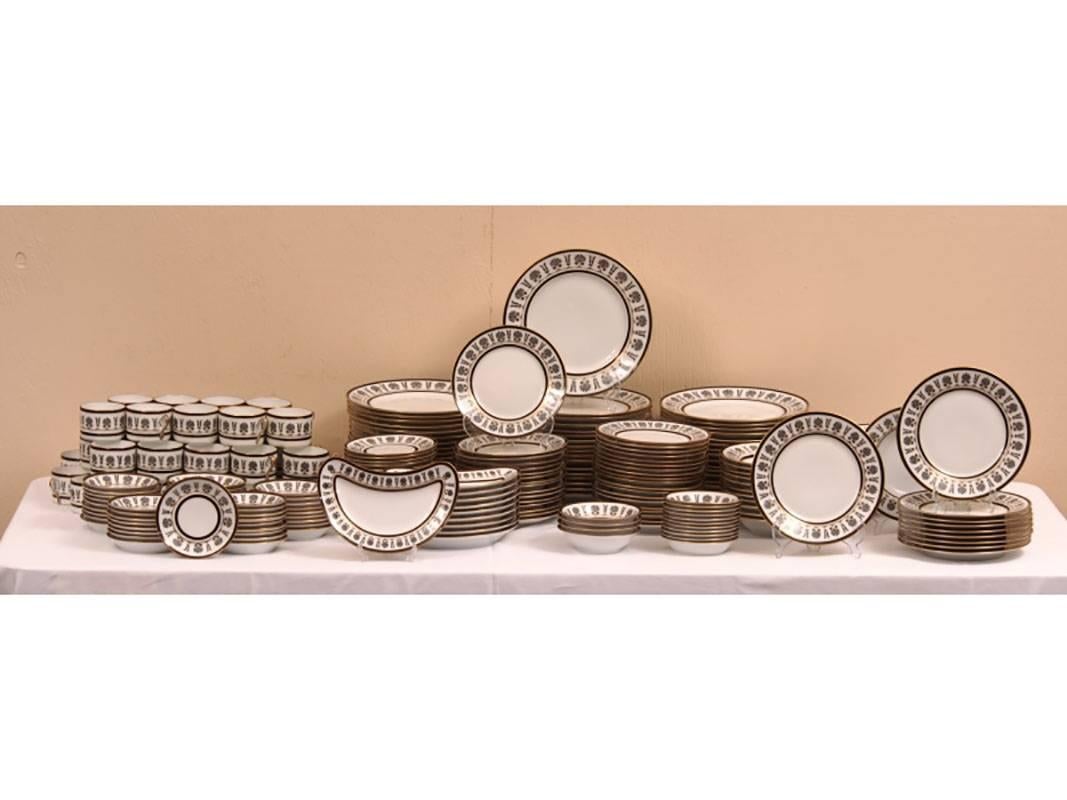 Richard Ginori extensive dinnerware set in Ercolano Black. Pattern having a black and gold floral and swirl design on white porcelain, gilt trim and banding. Service consists of:

(50) dinner plates 10.25