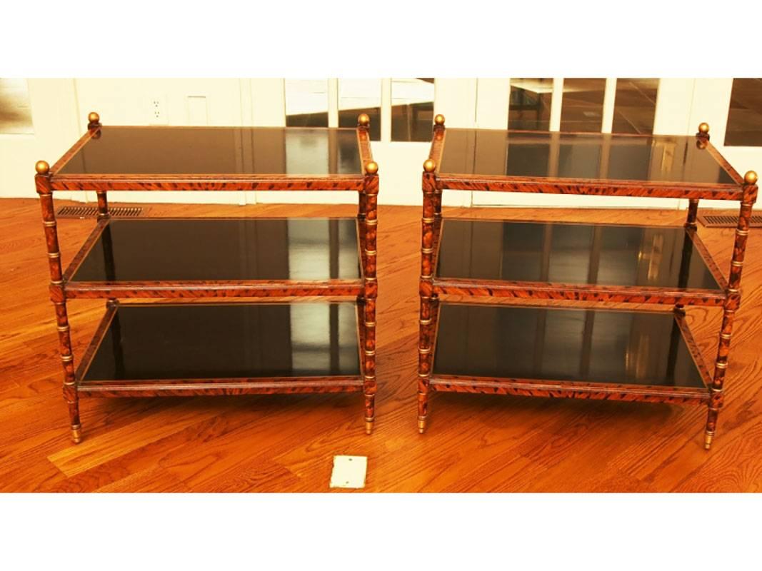 Fine pair of Mid-Century faux bamboo or faux tortoise and ebonized side tables with gilt accents. Excellent proportions and great style. There is some age scratching and light acceptable wear.