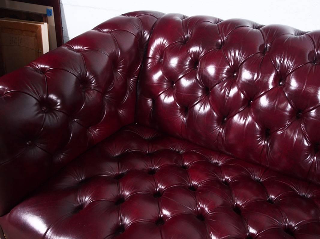 Regency Pair of Tufted Glazed Leather Chesterfield Sofas with Nailhead Trim