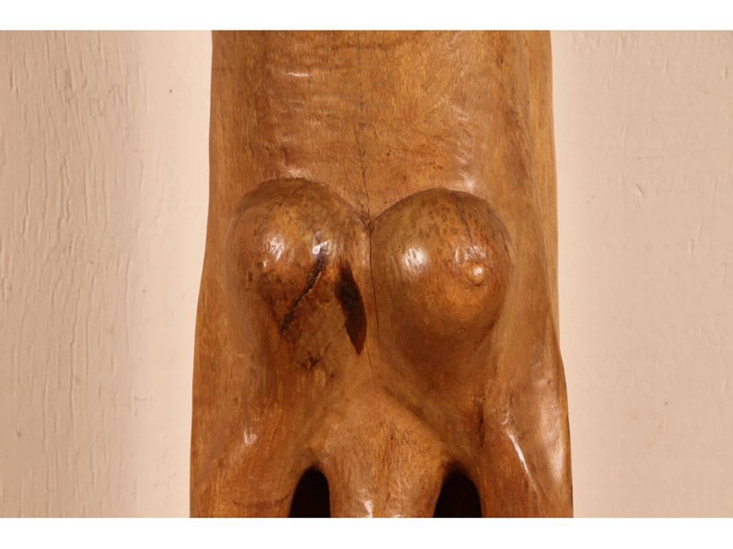 A tall and arresting Hand-Carved wood Sculpture of of an inverted woman. Strongly carved and in very good condition with only acceptable age-related wear including some stable checking to the wood. Signed on base. Nice original patina. Roger