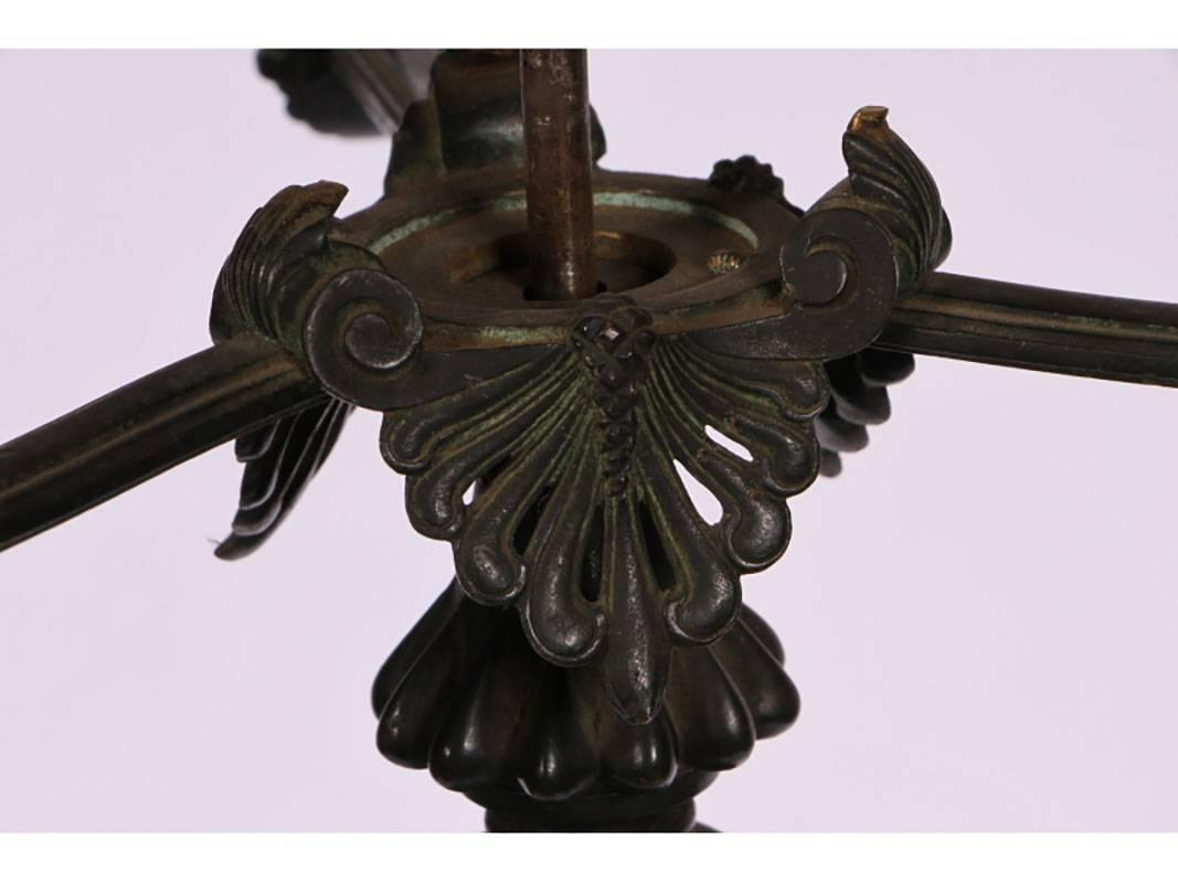 Beautifully cast base with figural brass decorated column on bronze arched legs with paw feet on a bronze and marble triangular base and raised on foliate brass feet. Top bracket with birds, snake on fluted column.
 