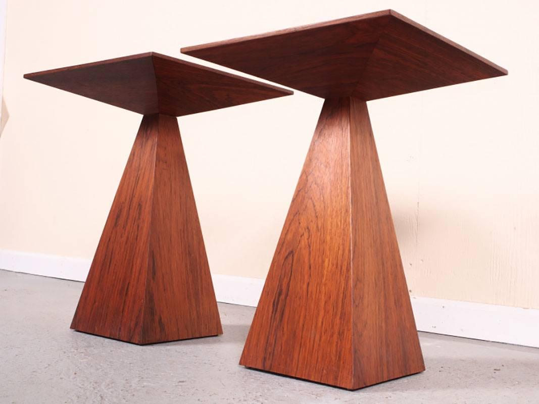 A pair of geometric sculpted wenge tables by Mid-Century designer Harvey Probber. Square tops with reverse tapered solid legs. Tables are in excellent condition.