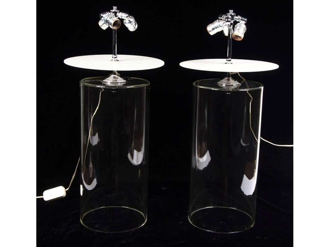 Pair of contemporary cannister glass lamps with white plexi disc top and chrome hardware.
  