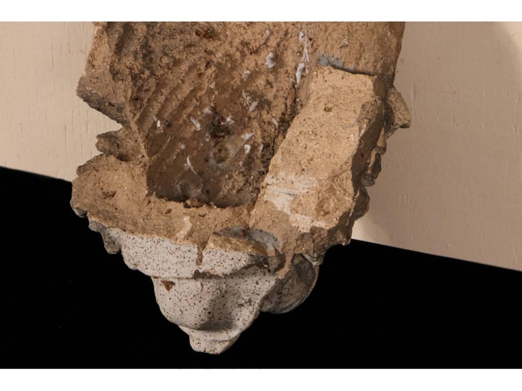 Heavy, hand poured terracotta in a hardened white marble finish fragment of a roaring lion.
Condition: Weathered.