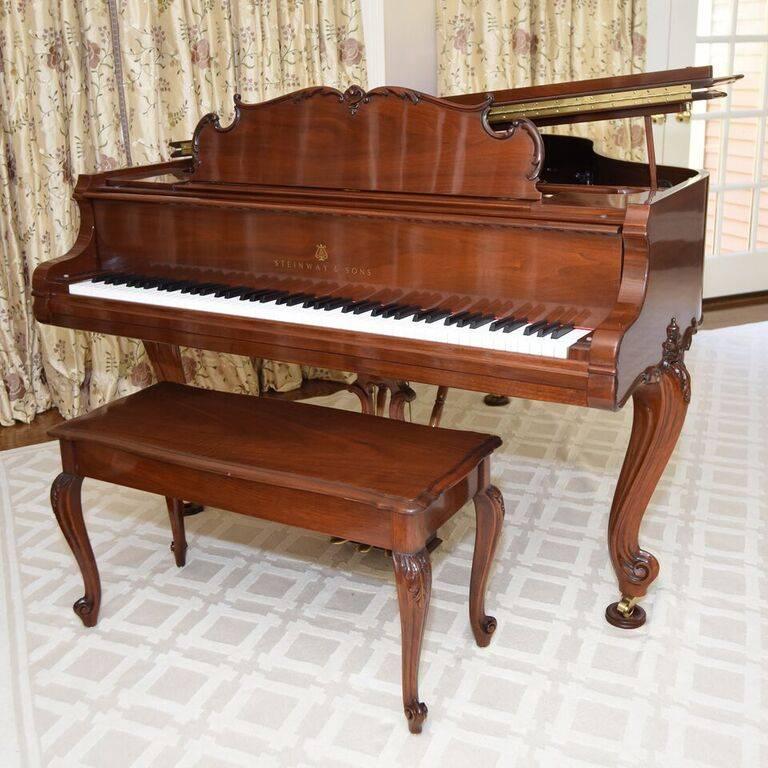 Made from hand-carved walnut, this Louis XV masterpiece weighs in at over 500 pounds and took over a year to make. Model 501A Louis XV walnut grand piano #567820. Purchased new from Steinway & Sons, New York, 2007. Signed by Steinway.
Bench