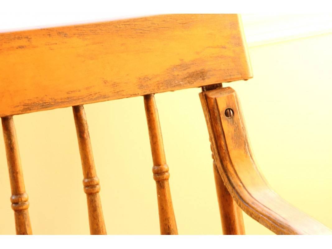 Hall bench with turned spindles, stretcher base, curved arms and turned legs.
Condition: Original condition with age appropriate rustic wear. Slightly loose joinery. Measures: 9 foot.