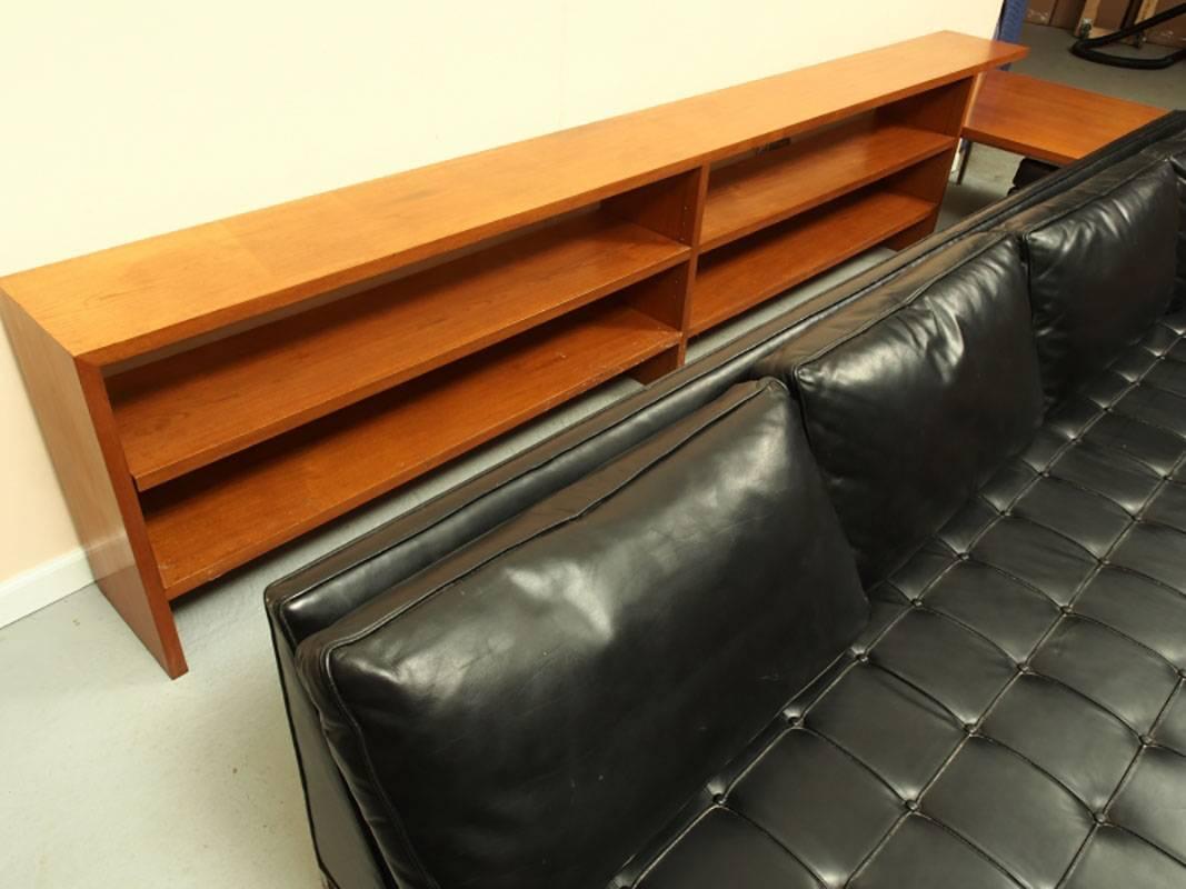 Black leather, rosewood and chrome custom design by Harvey Probber. Includes sofa, sofa table, end table (or coffee table) and large ottoman. All original condition with light appropriate wear, slight dings and minor scratches. The end/coffee table