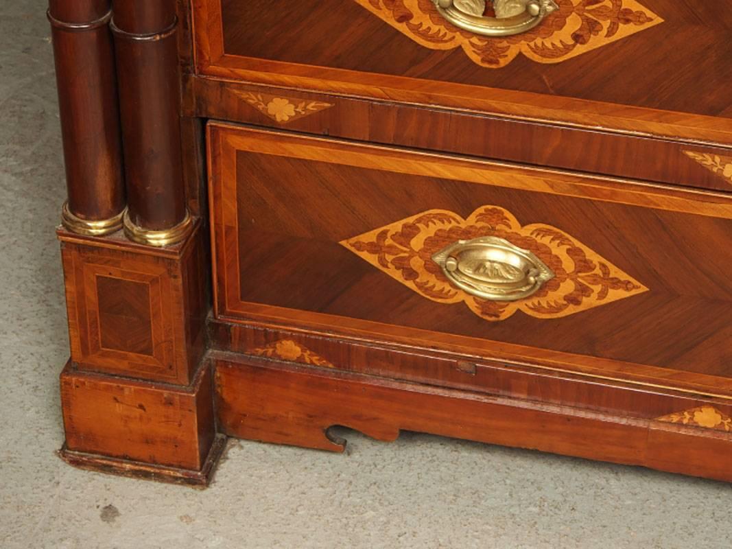 A very fine antique continental polished chest with inlaid banding and all-over finely detailed marquetry. Fine antique floral pulls, double column decorative supports with gilt accent. 
Condition: Please see all detail photos  There is a stable age