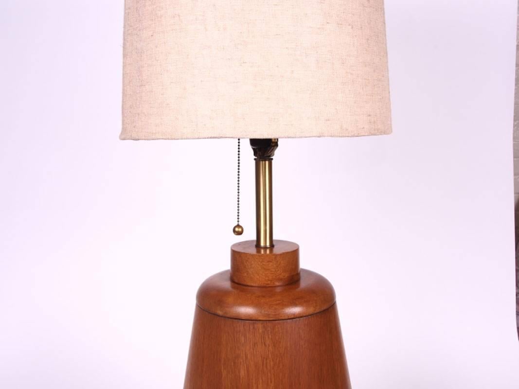 1960s wood and wood look vinyl lamp with a very sculptural style. The original shade has wear but is included.