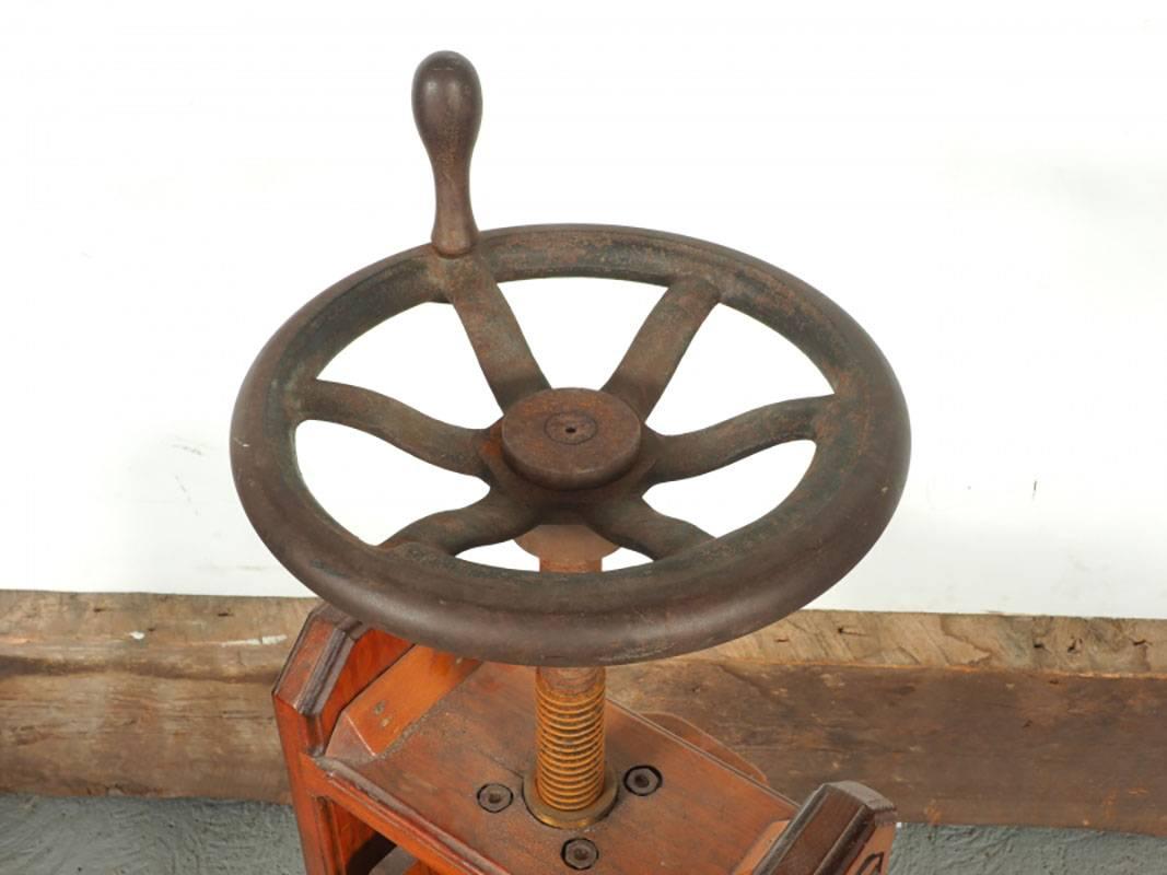 Antique grape press with beautifully carved side panels.
Condition: Very good, consistent with age and use.