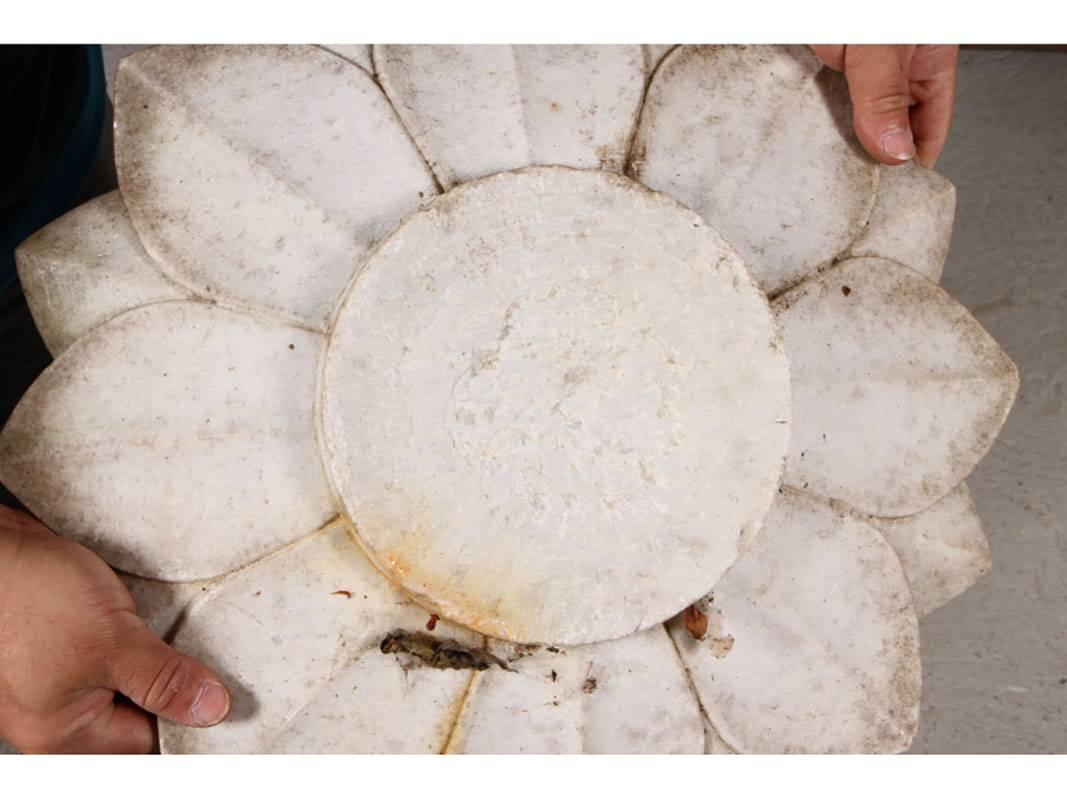 Lotus form carved marble shallow bowl for an outdoor garden or sanctuary.
Condition: some chipping, soiled/weathered, expected condition consistent with age and use.