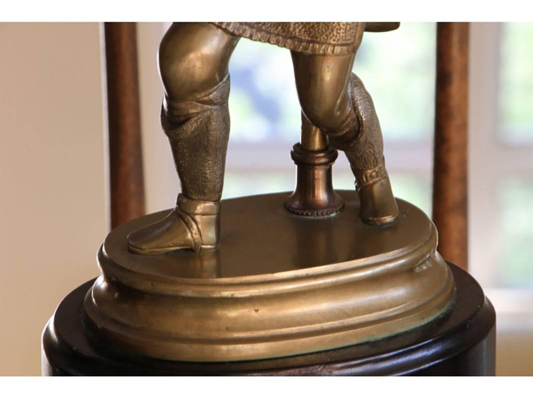 Pair of finely cast bronze figures attired in Renaissance attire, bearing faux candles mounted on ebonized bases.
Measurements: Lamp measures 35.5 high to top of finial. Base measures 7