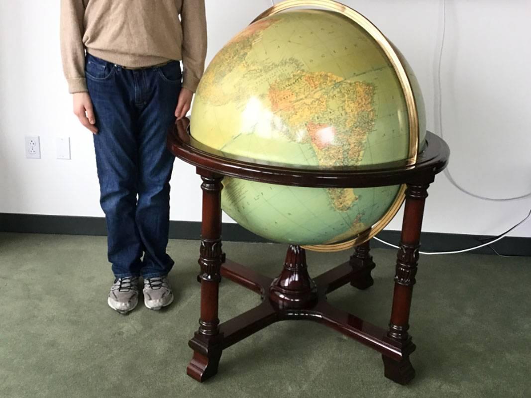 Chicago, Illinois. Designed and edited by Gustav Bruekmann, cartographer. Paper map over glass with several applied tabs dated 1957. Housed in a well crafted mahogany footed cradle with brass mounts.
Measurements: globe 50 inch; Diameter
stand