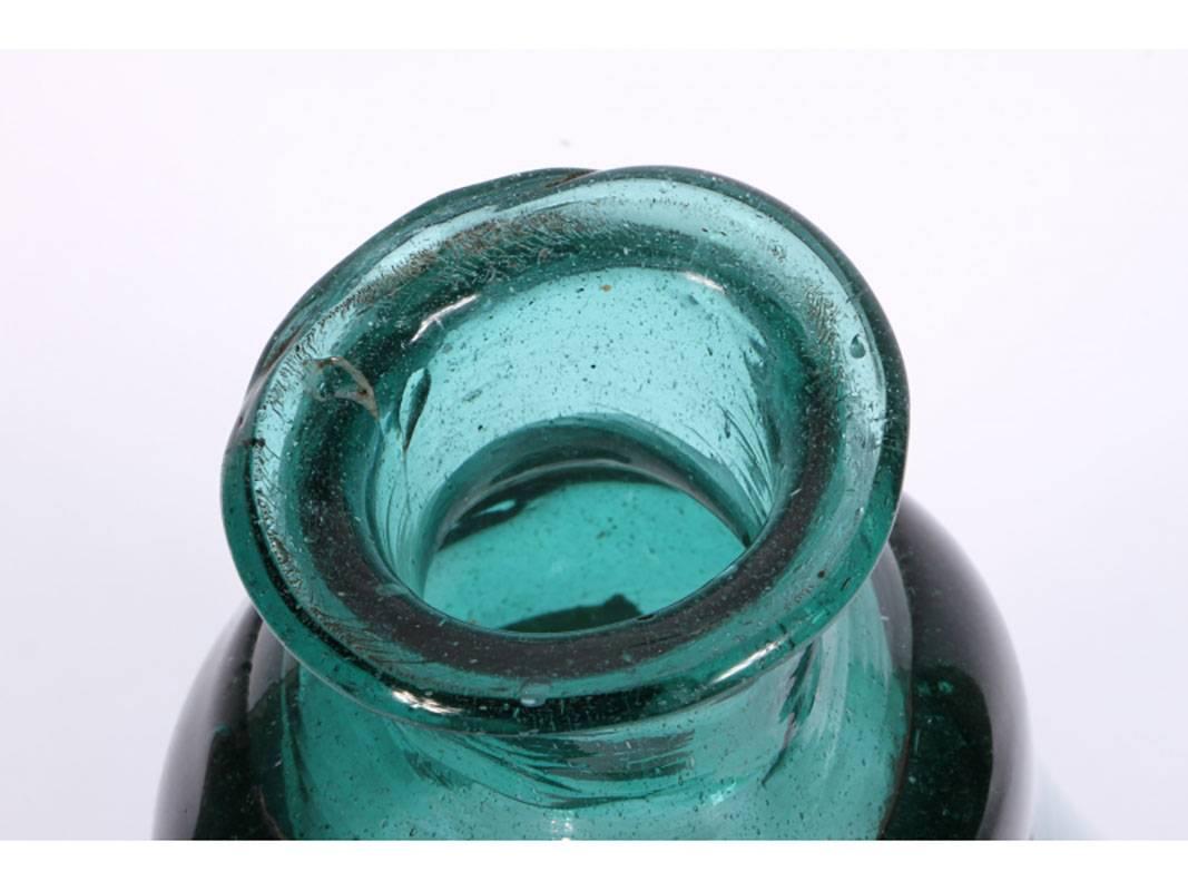 A medium blue-green pear shaped ancient bottle. Large and in very good condition.