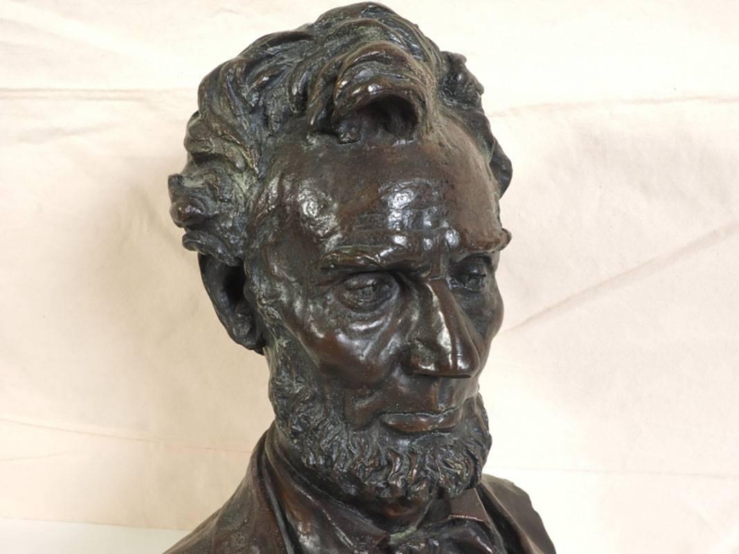 Cast bronze sculpture mounted on round marble base. Embedded signature on back, Geo. E. Bissell.